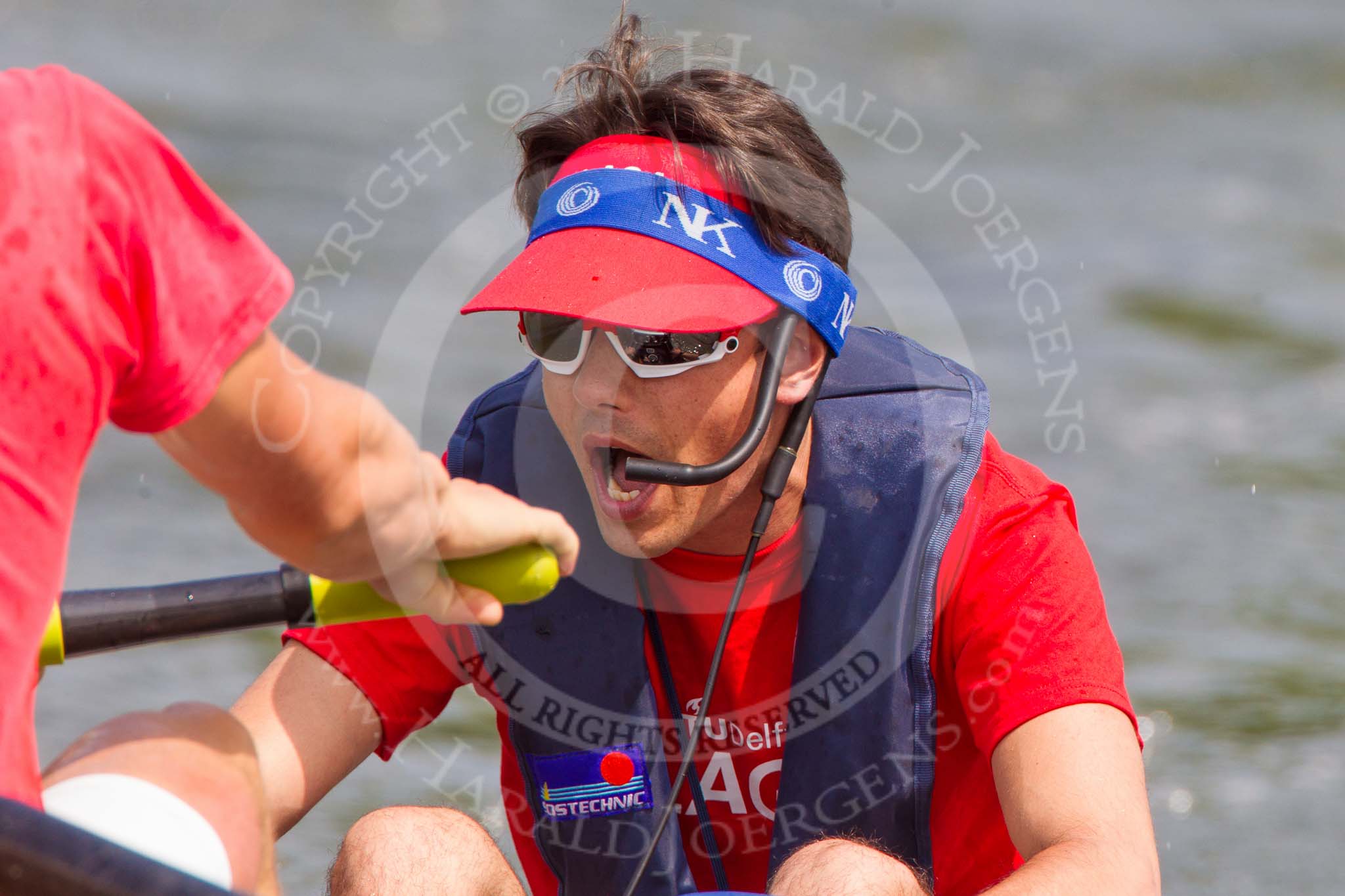 Henley Royal Regatta 2013, Saturday: Race No. 12 for the Temple Challenge Cup, St. Petersburg University, Russia (orage), v Delftsche Studenten Roeivereeninging Laga, Holland (red), here Laga cox R. K. P. den Drÿver. Image #251, 06 July 2013 11:51 River Thames, Henley on Thames, UK