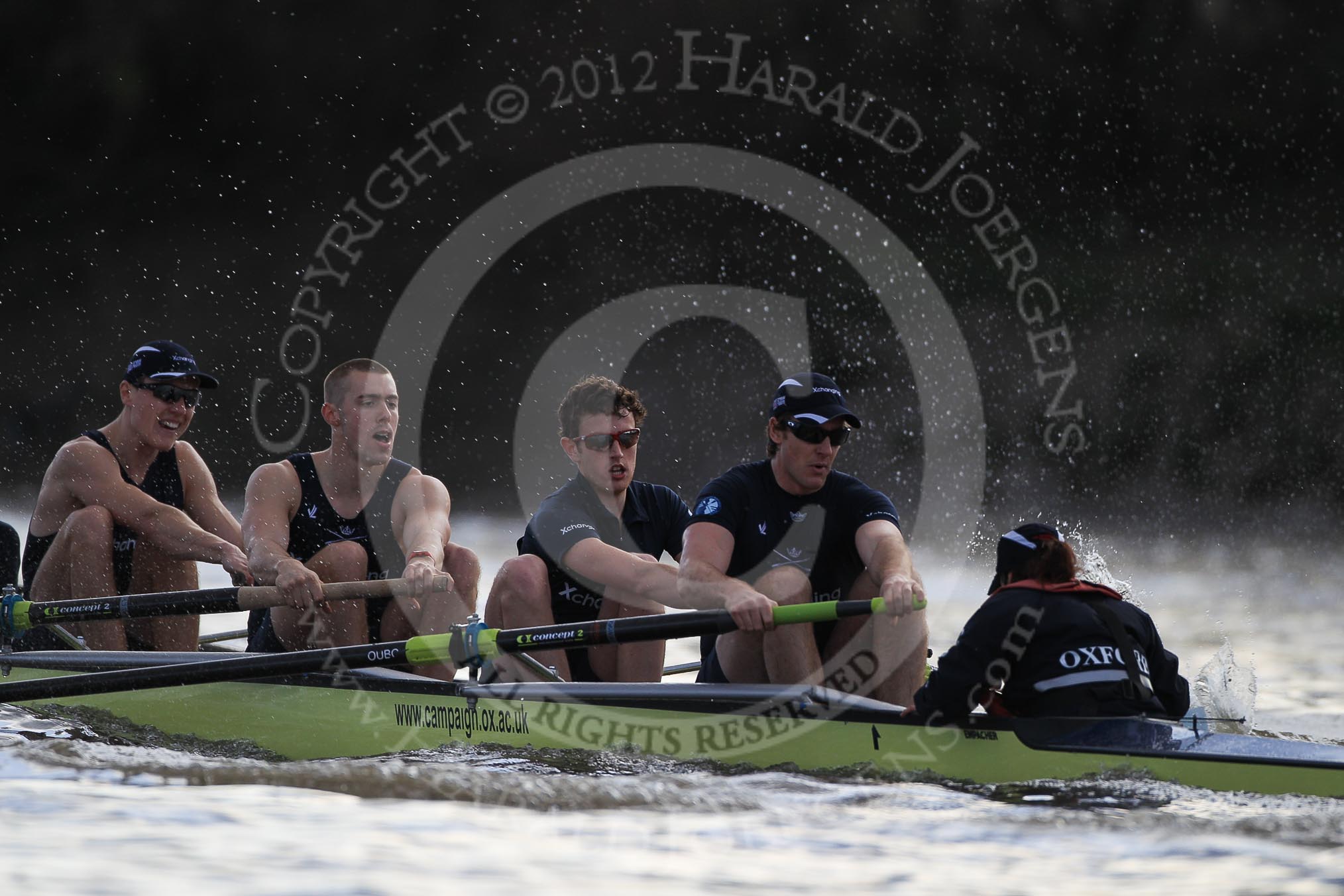 The Boat Race season 2012 - fixture OUBC vs German U23: Approaching the finish line of the second race, the Oxford Blue Boat, from left to right Karl Hudspith, Alex Davidson, Dan Harvey, stern Roel Haen, and cox Zoe de Toledo..
River Thames between Putney and Mortlake,
London,

United Kingdom,
on 26 February 2012 at 15:49, image #95