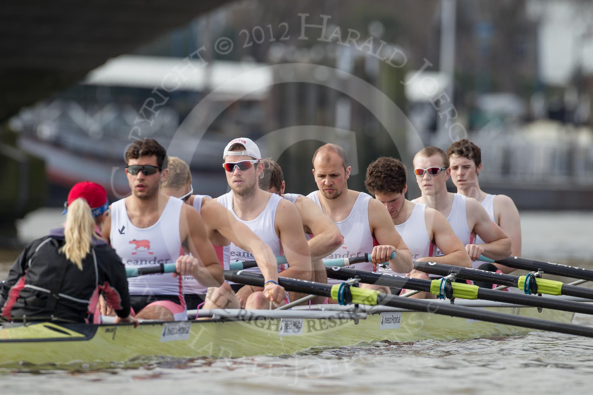 The Boat Race season 2012 - fixture CUBC vs Leander: The Leander Club Eight preparing for the start of the race at Putney Bridge. Cox Katie Klavenes, stroke Vasillis Ragoussis, Cameron MacRitchie, Sean Dixon, Tom Clark, John Clay, Will Gray, Sam Whittaker, and bow Oliver Holt..
River Thames between Putney and Molesey,
London,
Greater London,
United Kingdom,
on 10 March 2012 at 14:11, image #86