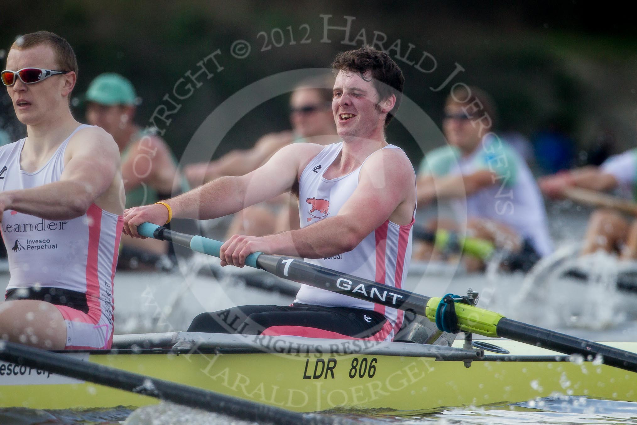 The Boat Race season 2012 - fixture CUBC vs Leander: The Leander Club Eight:  Close-up of 2 Sam Whittaker and bow Oliver Holt, behind, and in the lead, the Cambridge Eight..
River Thames between Putney and Molesey,
London,
Greater London,
United Kingdom,
on 10 March 2012 at 14:18, image #143