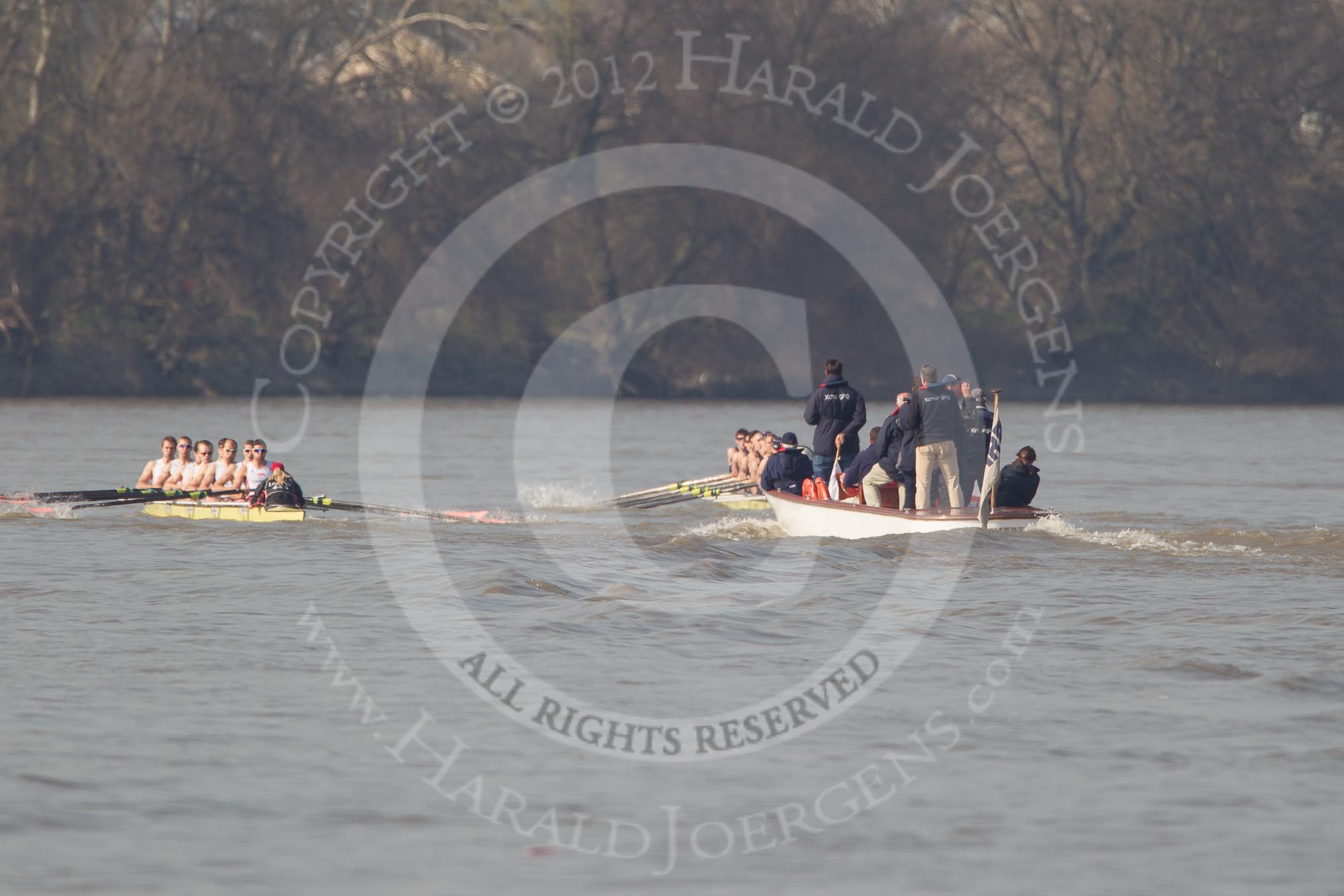 The Boat Race season 2012 - fixture OUBC vs Leander: OUBC Blue Boat in the lead - 2 William Zeng, 3 Kevin Baum, 4 Alexander Davidson, 5 Karl Hudspith, 6 Dr. Hanno Wienhausen, 7 Dan Harvey, stroke Roel Haen, cox Zoe de Toledo, in the Leander boat bow Nathan Hillyer, Chris Friend, Will Gray, Sam Whittaker, Tom Clark, John Clay, Cameron MacRitchie, stroke Vasillis Ragoussis, and cox Katie Klavenes. Behind the two boats the umpire Richard Phelps..




on 24 March 2012 at 14:30, image #131