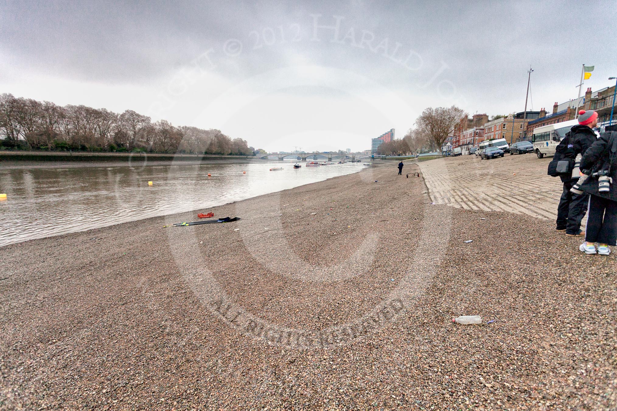 The River Thames at low tide in the morning of April 5, with photographers waiting for an outing of Cambridge and Oxford University Boat Clubs ahead of the 2012 Boat Race on April  7.