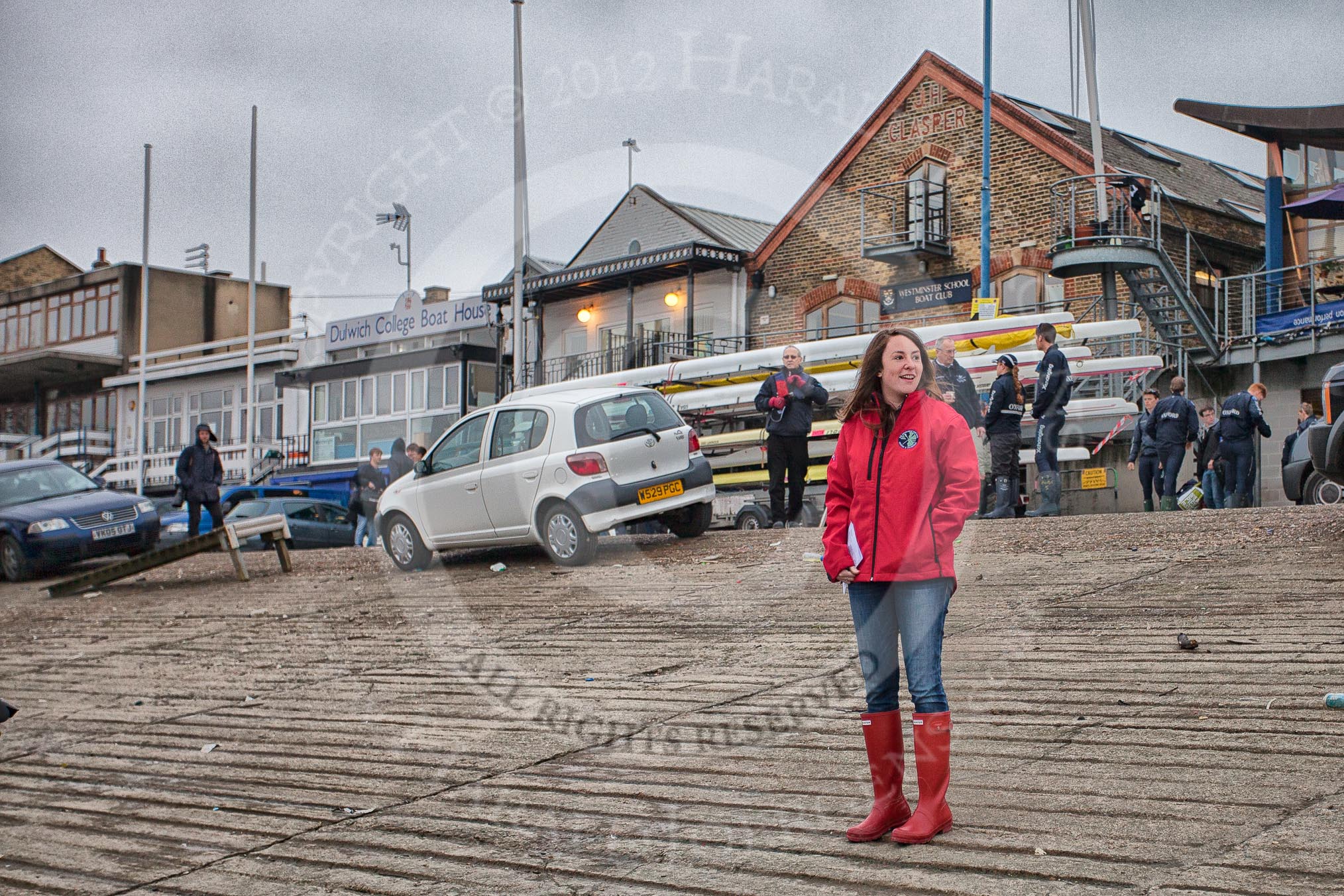 Liz Box, 2011 Cambridge Blue Boat cox, and Account Executive of Professional Sports Group, the organizer of the 2012 Boat Race.  In the background on the right the crew of Isis, the Oxford reserve boat.