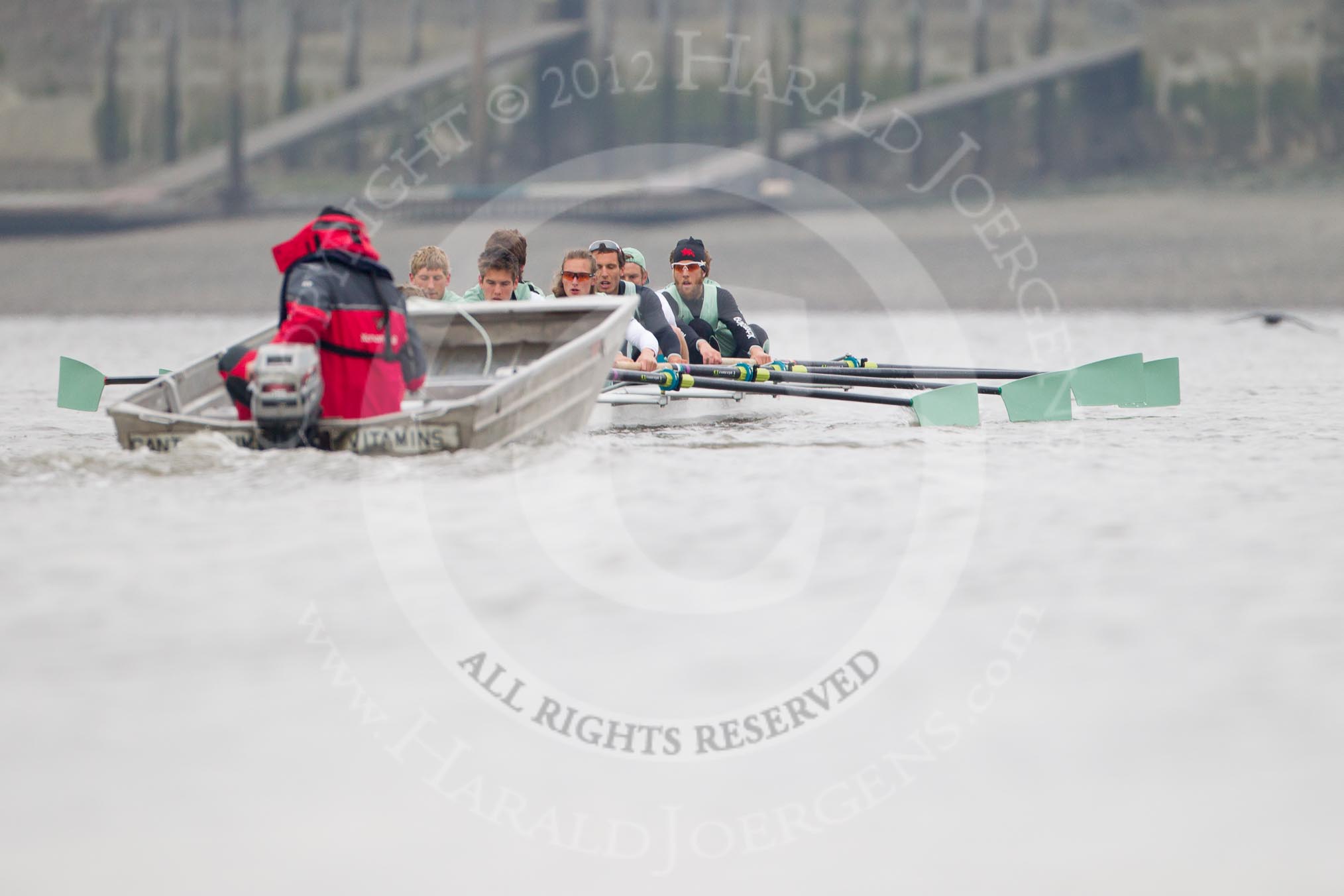 Cambridge University Boat Club chief coach Steve Trapmore and the CUBC Blue Boat during an outing on the River Thames, two days before the 2012 Boat Race.