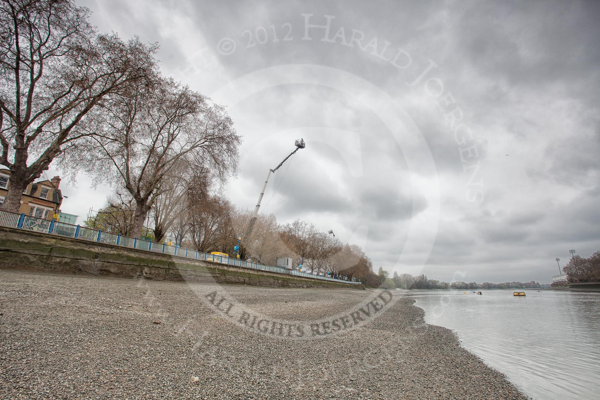 The Boat Race 2012: Setting the scene for the 2012 Boat Race: The River Thames as low tide, seen in the direction of the race, on the right Fulham FC Stadium, on the left two BBC Sport camera cranes..




on 07 April 2012 at 09:34, image #6