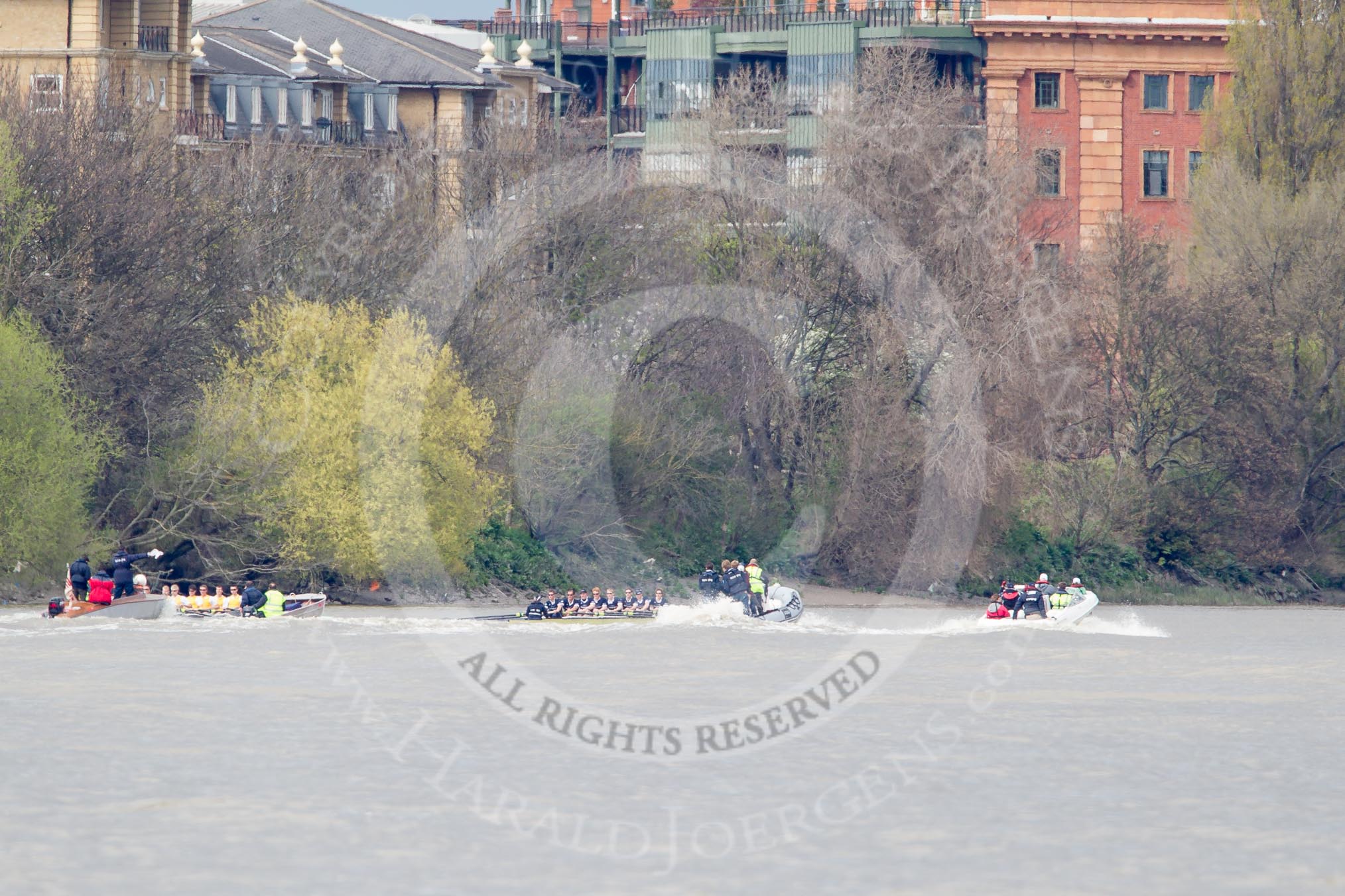 The Boat Race 2012: The Isis v Goldie Boat Race. The Oxford reserve boat Isis, on the right, in the lead, approaching Harrord Repository, behind Goldie race umpire John Garret..




on 07 April 2012 at 13:49, image #189