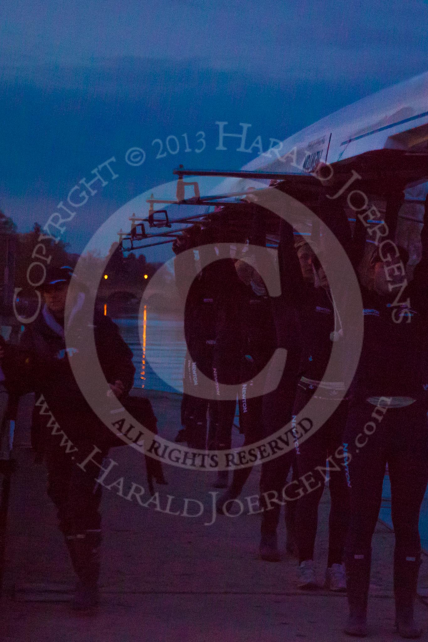 The Boat Race season 2013 - OUWBC training: The OUWBC Osiris crew getting the boat out of the water in near darkness after a long training session for the Women's Boat Race..
River Thames,
Wallingford,
Oxfordshire,
United Kingdom,
on 13 March 2013 at 18:30, image #238