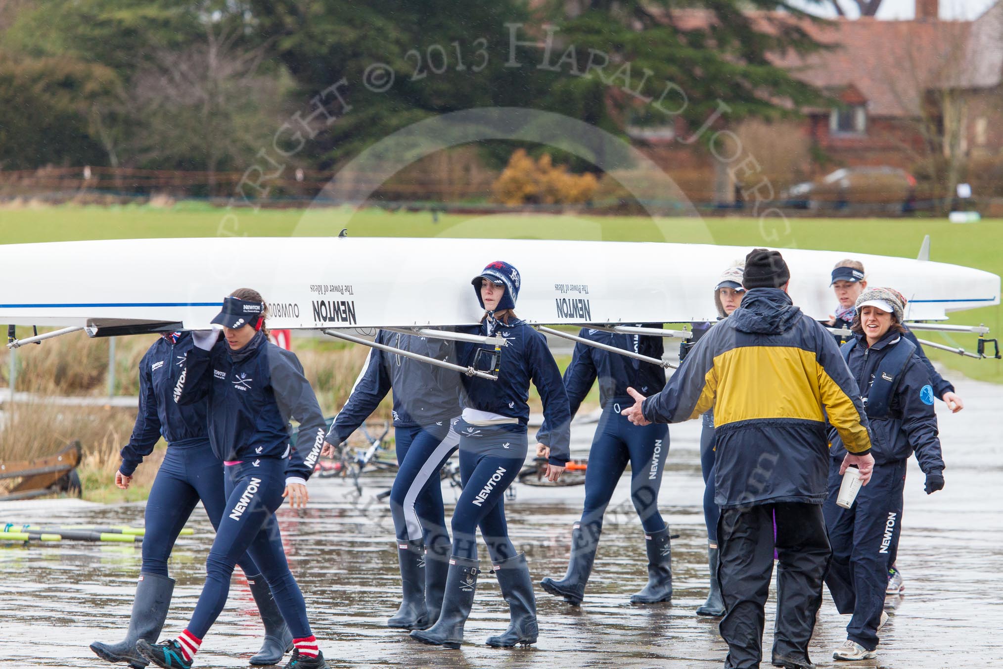 The Boat Race season 2013 - fixture OUWBC vs Olympians: On the way to meet the Olympians - the crew of the OUWBC reserve boat Osiris carrying their boat towards Dorney Lake..
Dorney Lake,
Dorney, Windsor,
Buckinghamshire,
United Kingdom,
on 16 March 2013 at 10:57, image #9