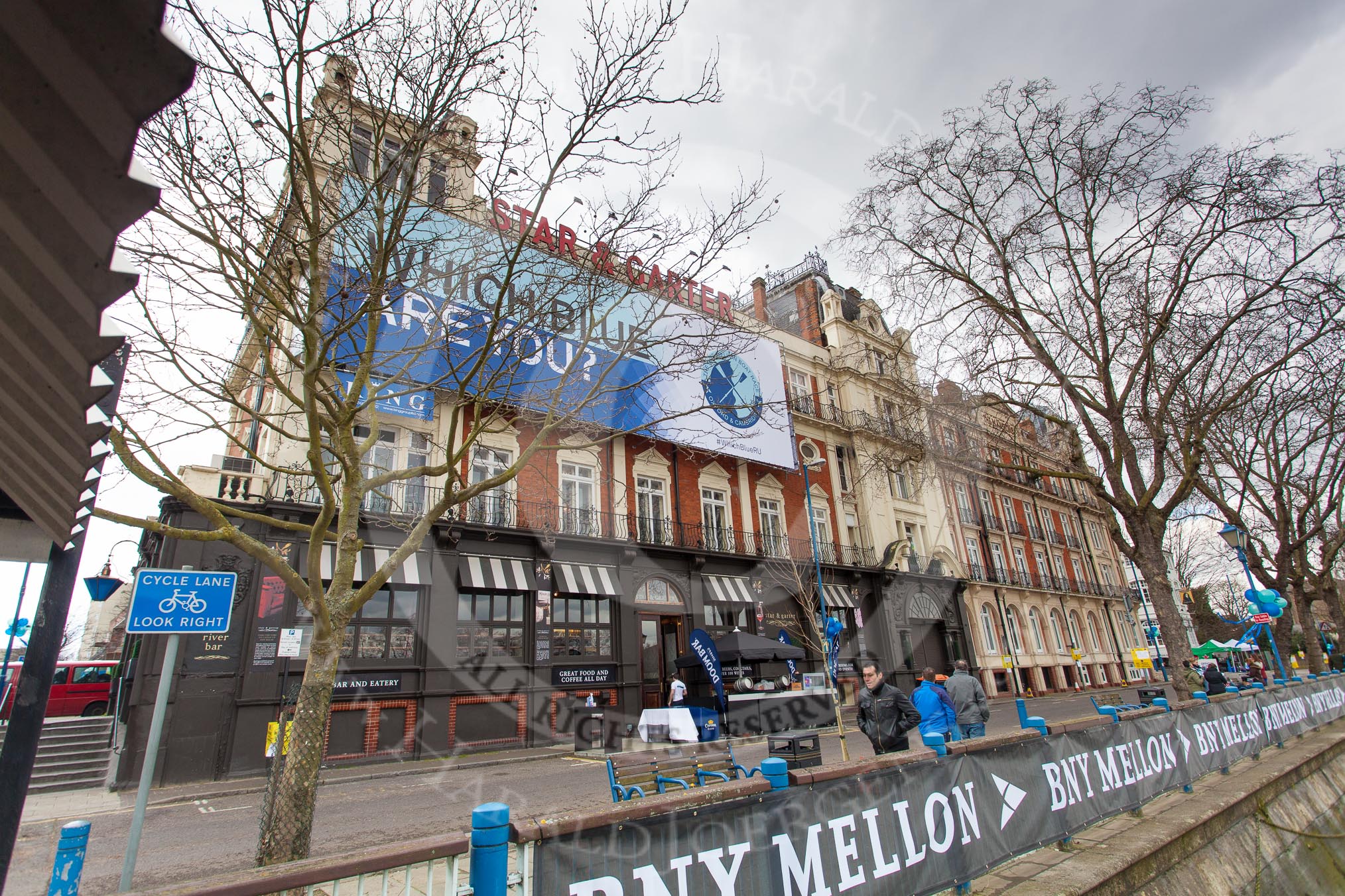 The Boat Race 2013: "Which Blue are you"-billboard by Boat Race sponsor BNY Mellon ouside the Star & Garter River Bar & Eaterty at Putney Embankment..
Putney,
London SW15,

United Kingdom,
on 31 March 2013 at 11:21, image #14