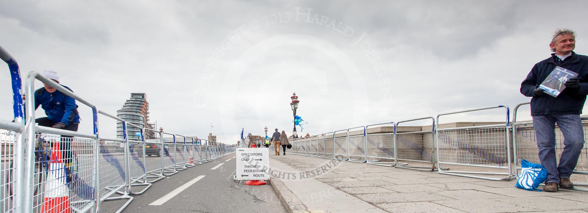 The Boat Race 2013: Preparations for thousands of Boat Race spectators on Putney Bridge (seen from the Fulham side), hours before the start of the 2013 Boat Race. On the left Putney Wharf Tower..
Putney,
London SW15,

United Kingdom,
on 31 March 2013 at 11:53, image #36