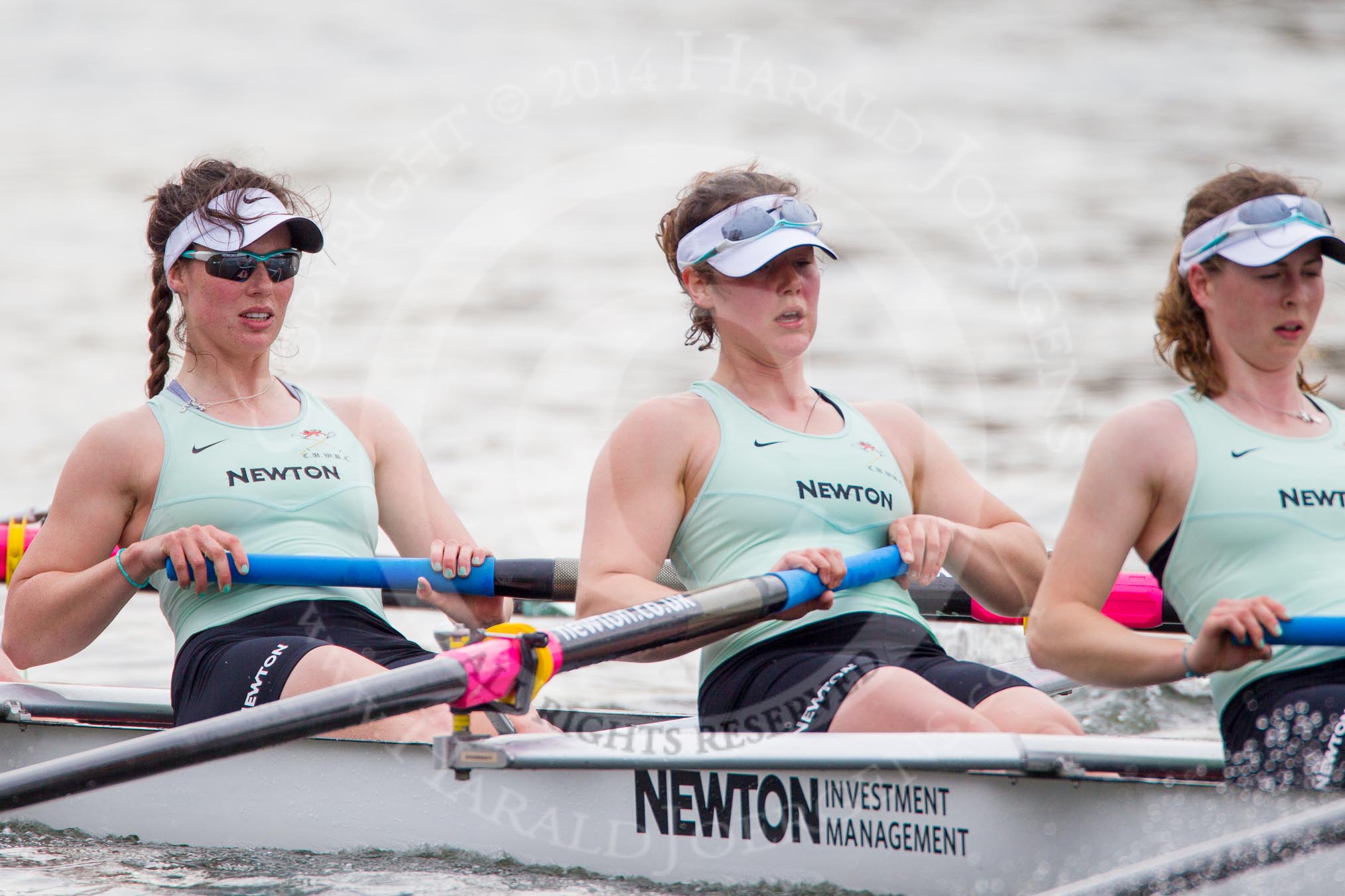 The Women's Boat Race and Henley Boat Races 2014: After  the Newton Women's Boat Race, the Cambridge crew is rowing back to Henley. Here, in the 6 seat, Melissa Wilson, 7 Claire Watkins, stroke Emily Day..
River Thames,
Henley-on-Thames,
Buckinghamshire,
United Kingdom,
on 30 March 2014 at 15:23, image #350