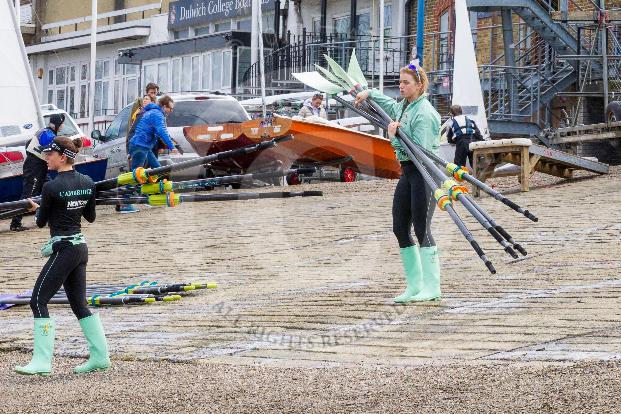 The Boat Race season 2017 - Women's Boat Race Fixture CUWBC vs Univerity of London: CUWBC's 4, Imogen Grant, and stroke Alice White carrying oars from the boat house.
River Thames between Putney Bridge and Mortlake,
London SW15,

United Kingdom,
on 19 February 2017 at 15:13, image #2