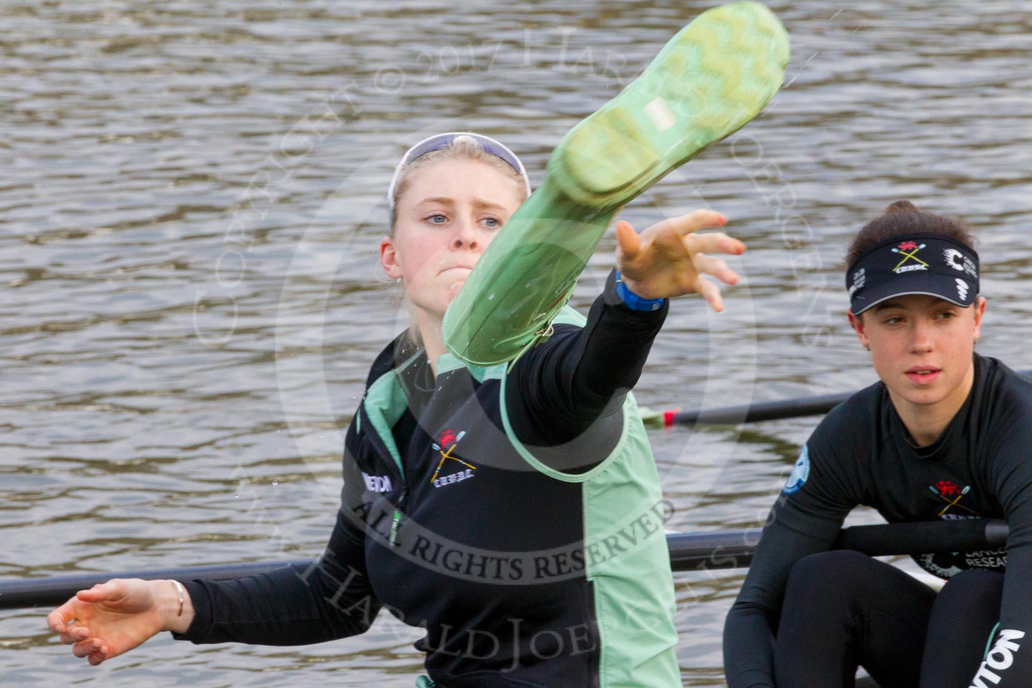 The Boat Race season 2017 - Women's Boat Race Fixture CUWBC vs Univerity of London: CUWBC's 5, Holly Hill, and 4 Imogen Grant getting rid of their Wellies.
River Thames between Putney Bridge and Mortlake,
London SW15,

United Kingdom,
on 19 February 2017 at 15:17, image #12