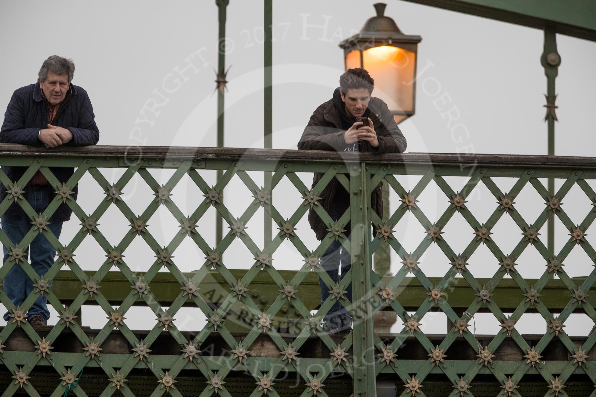 The Boat Race season 2017 - Women's Boat Race Fixture CUWBC vs Univerity of London: Spectators (friends and faily) on Hammersmith Bridge.
River Thames between Putney Bridge and Mortlake,
London SW15,

United Kingdom,
on 19 February 2017 at 16:09, image #98