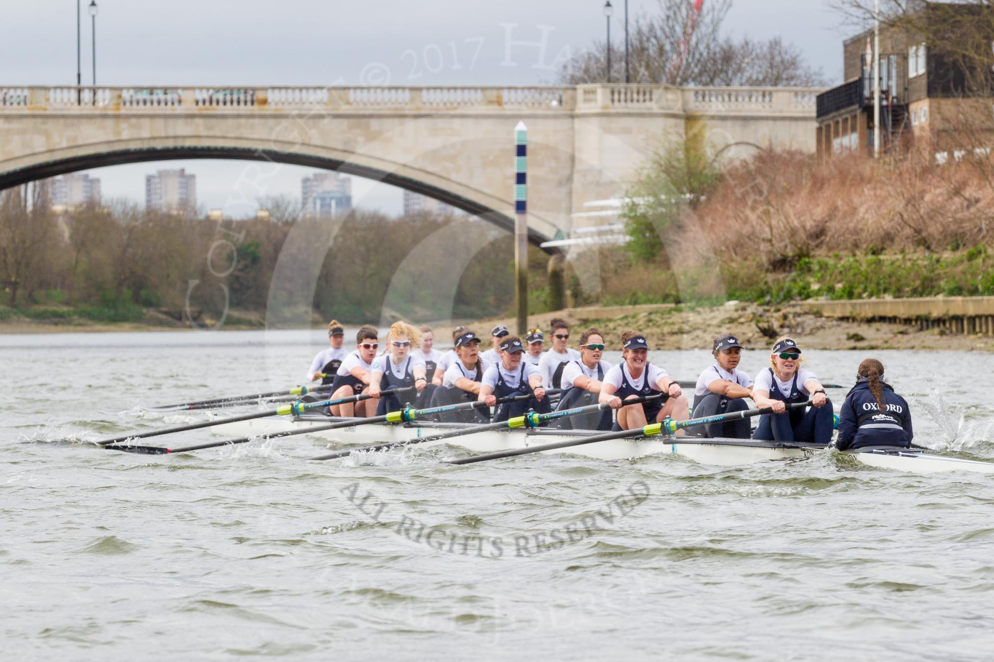 The Cancer Research UK Boat Race season 2017 - Women's Boat Race Fixture OUWBC vs Molesey BC: OUWBC half a length behind Molesey just before the finish line  - bow Alice Roberts, 2 Beth Bridgman, 3 Rebecca Te Water Naude, 4 Rebecca Esselstein, 5 Chloe Laverack, 6 Harriet Austin, 7 Jenna Hebert, stroke Emily Cameron, cox Eleanor Shearer.
River Thames between Putney Bridge and Mortlake,
London SW15,

United Kingdom,
on 19 March 2017 at 16:25, image #158