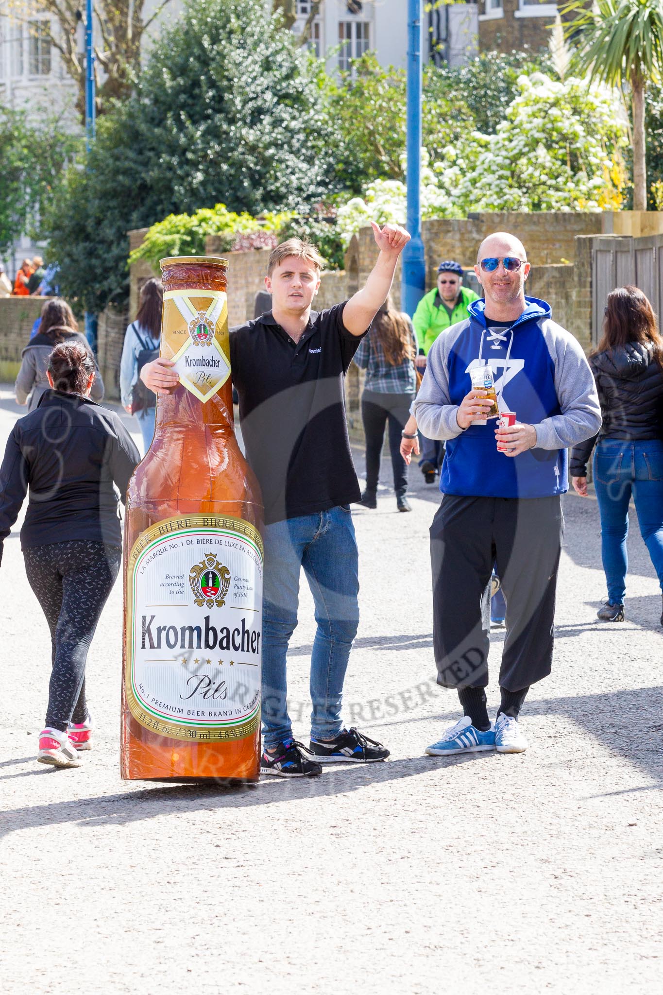 The Boat Race season 2017 -  The Cancer Research Women's Boat Race: Marketing for German "Krombacher" beer at Putney Embankment.
River Thames between Putney Bridge and Mortlake,
London SW15,

United Kingdom,
on 02 April 2017 at 13:19, image #2