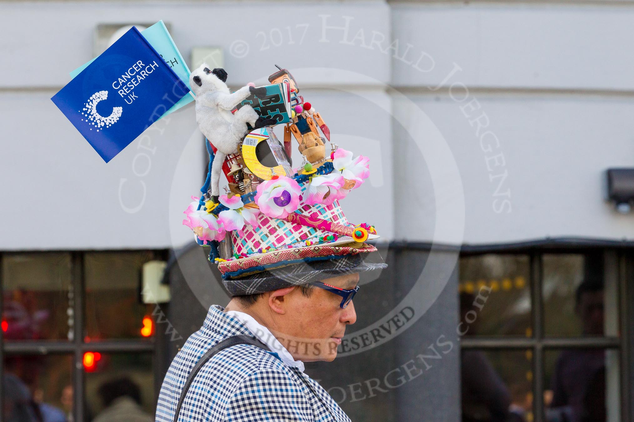 The Boat Race season 2017 -  The Cancer Research Women's Boat Race: A gentleman who's either a real Boat Race fan. or selling "stuff".
River Thames between Putney Bridge and Mortlake,
London SW15,

United Kingdom,
on 02 April 2017 at 13:57, image #9