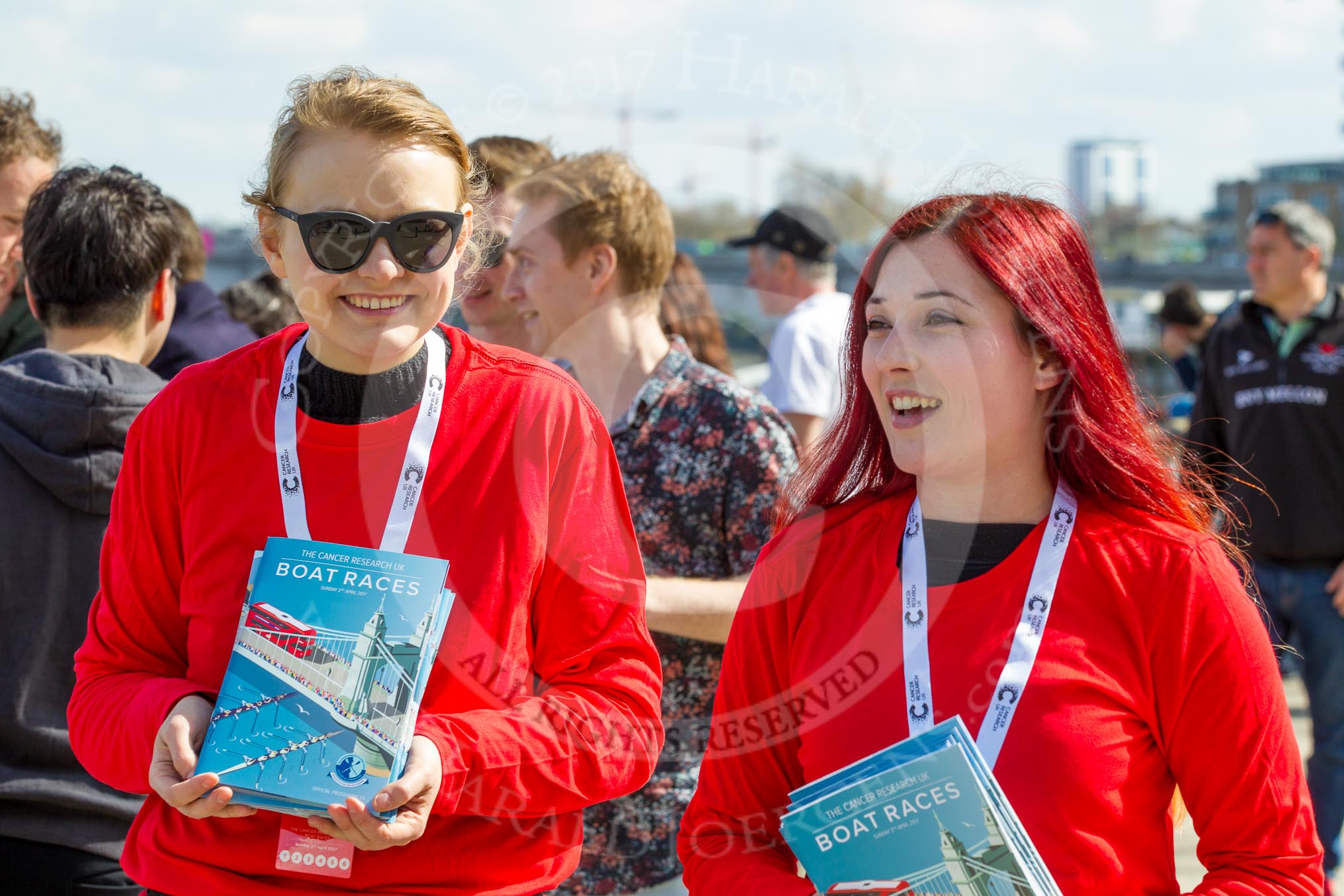 The Boat Race season 2017 -  The Cancer Research Women's Boat Race: Two young ladies selling Boat Race programmes.
River Thames between Putney Bridge and Mortlake,
London SW15,

United Kingdom,
on 02 April 2017 at 14:00, image #11