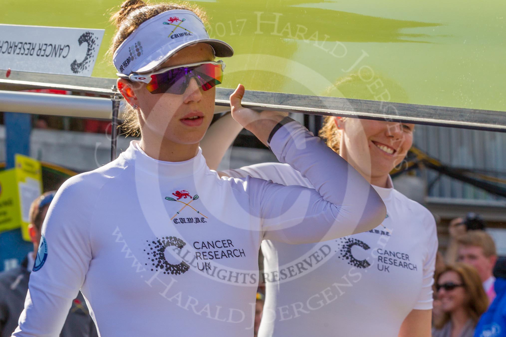 The Boat Race season 2017 -  The Cancer Research Women's Boat Race: CUWBC carrying the Cambridge boat from the boat house to the river, on the left 2 seat Imogen Grant, on the right bow Ashton Brown.
River Thames between Putney Bridge and Mortlake,
London SW15,

United Kingdom,
on 02 April 2017 at 15:47, image #57