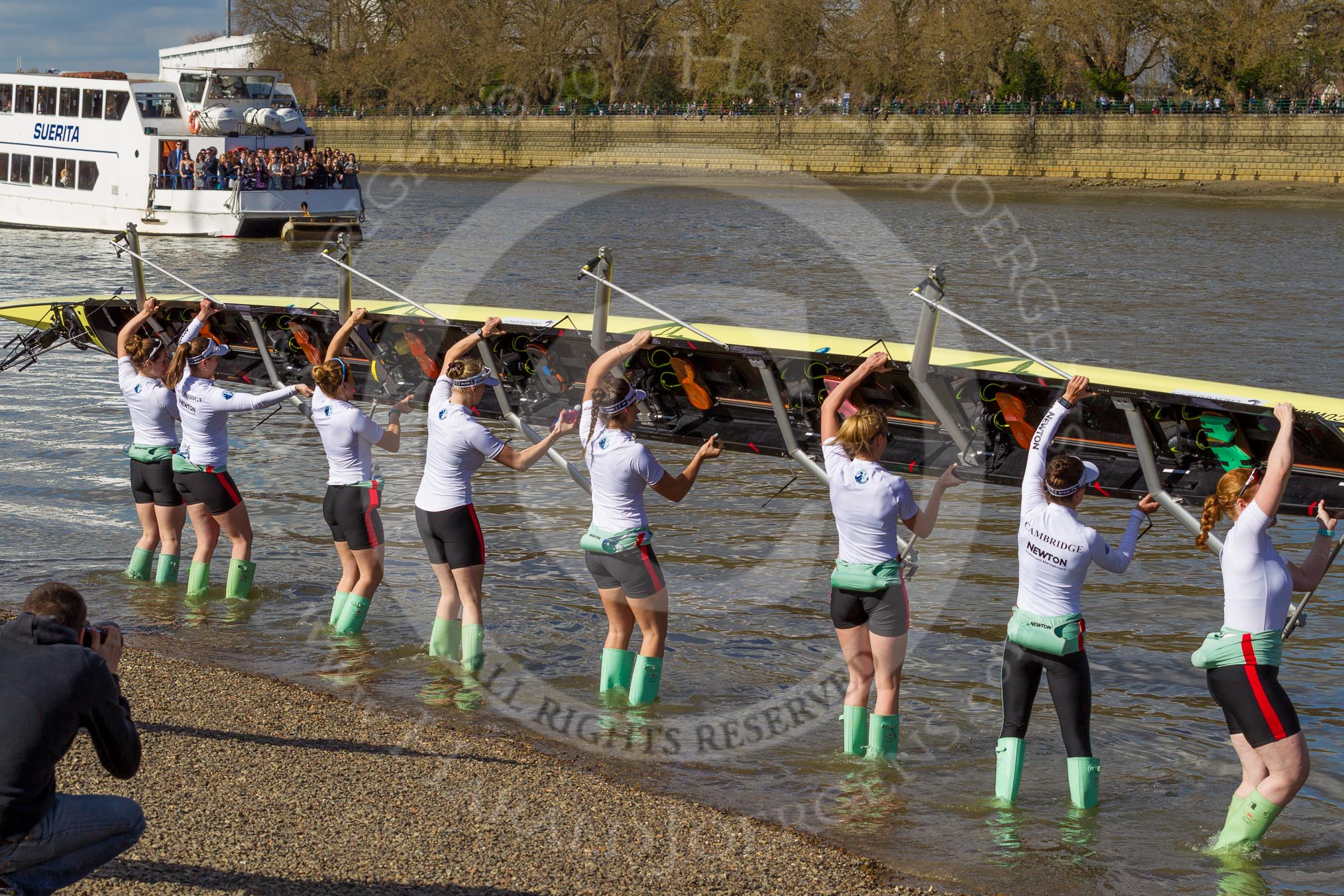 The Boat Race season 2017 -  The Cancer Research Women's Boat Race: CUWBC carrying the Cambridge boat from the boat house and turning it around to put it into the river.
River Thames between Putney Bridge and Mortlake,
London SW15,

United Kingdom,
on 02 April 2017 at 15:47, image #60