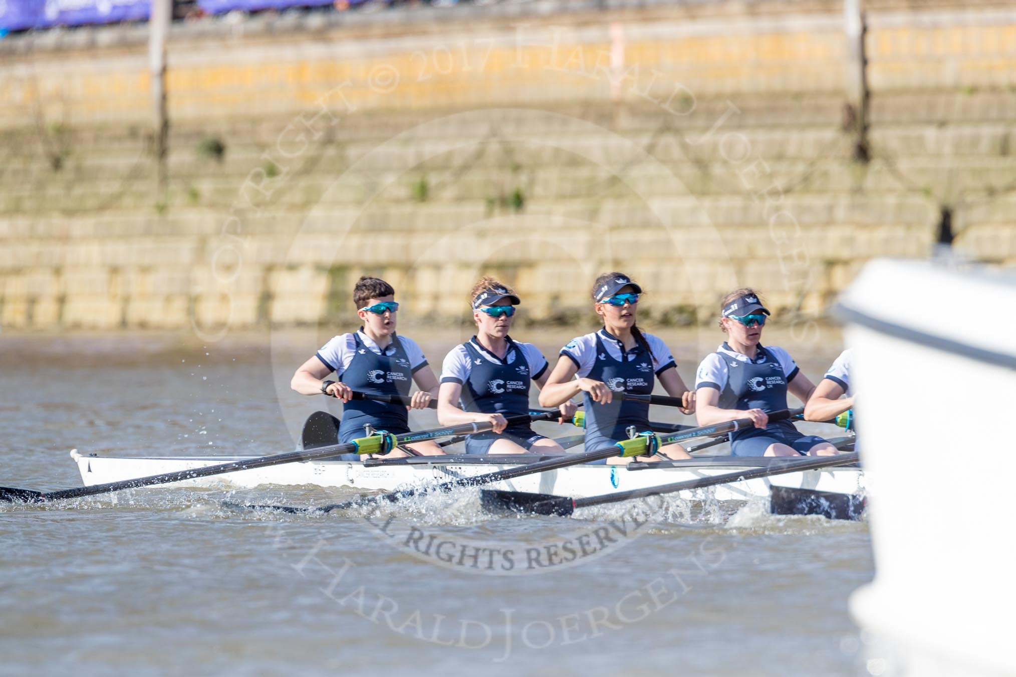 The Boat Race season 2017 -  The Cancer Research Women's Boat Race: OUWBC working hard to catch up with Cambridge, here bow Ashton Brown, 2 Imogen Grant, 3 Claire Lambe, 4 Anna Dawson.
River Thames between Putney Bridge and Mortlake,
London SW15,

United Kingdom,
on 02 April 2017 at 16:36, image #130