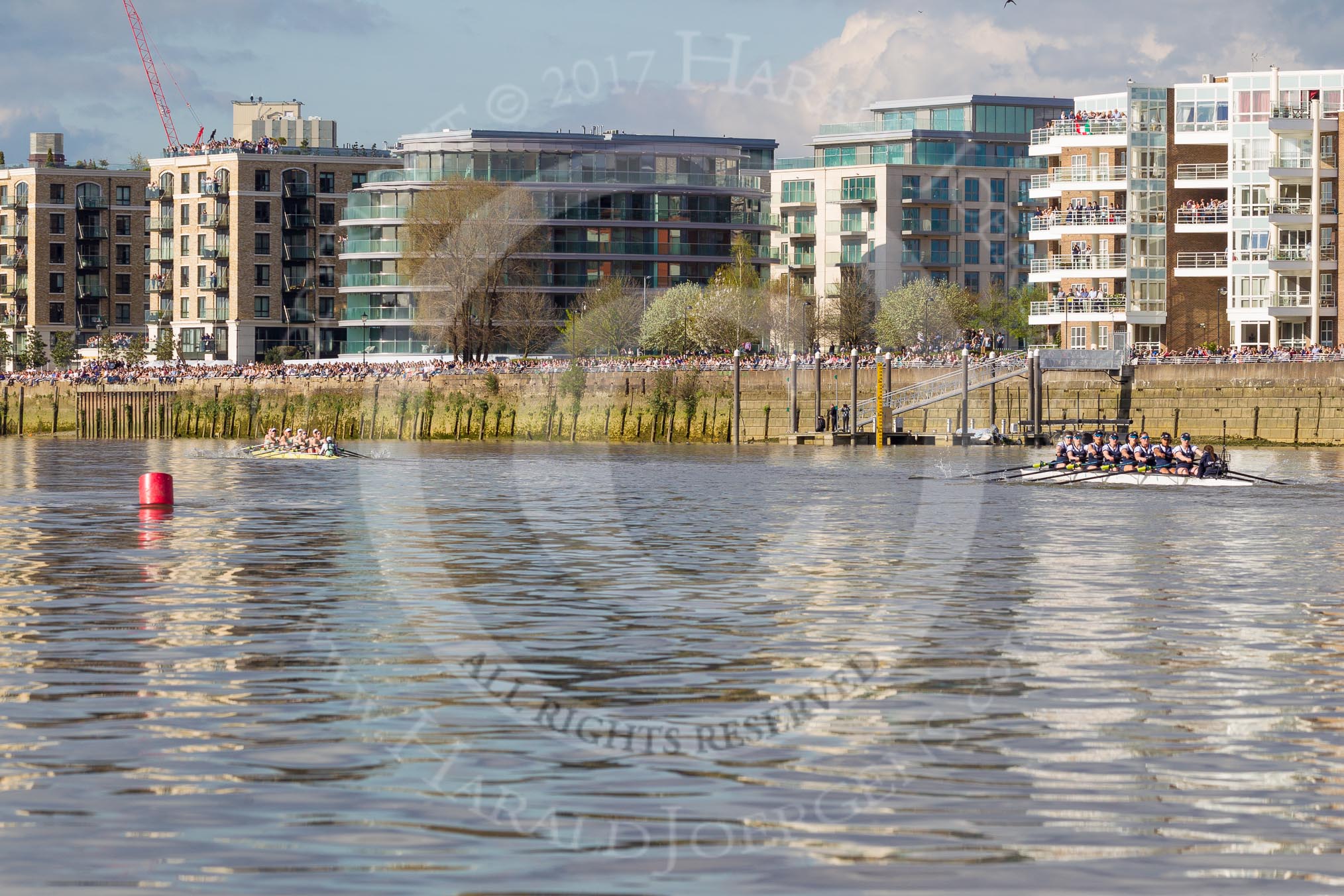 The Boat Race season 2017 -  The Cancer Research Women's Boat Race: Crowds along the Thames  as the CUWBC and OUWBC pass Fulham Reach.
River Thames between Putney Bridge and Mortlake,
London SW15,

United Kingdom,
on 02 April 2017 at 16:40, image #149