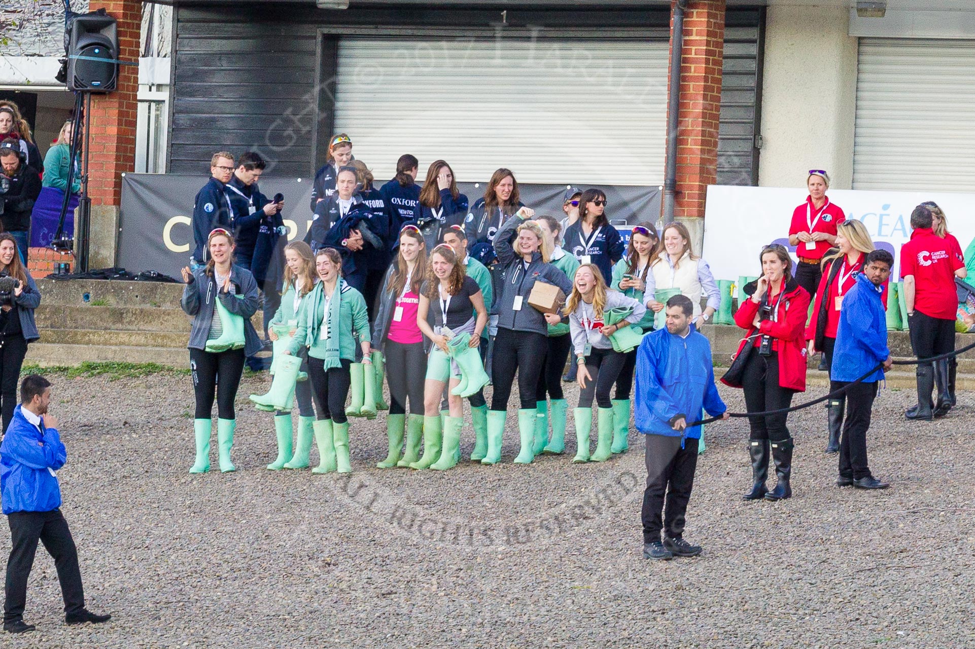 The Boat Race season 2017 -  The Cancer Research Women's Boat Race: Oxford and Cambridge support crews with Boat Race organizers at Mortlake Anglian & Alpha Boat Club.
River Thames between Putney Bridge and Mortlake,
London SW15,

United Kingdom,
on 02 April 2017 at 16:57, image #194