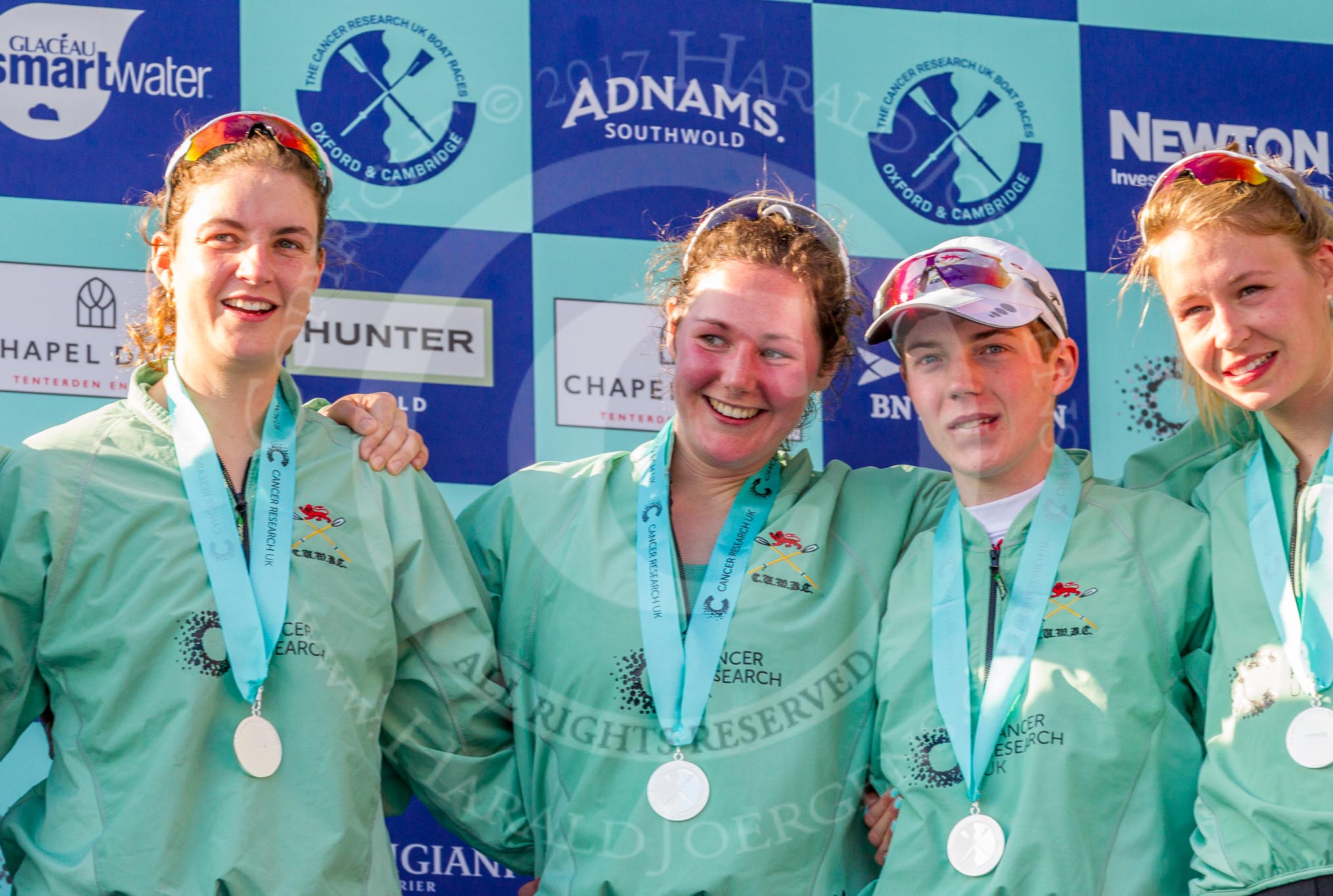 The Boat Race season 2017 -  The Cancer Research Women's Boat Race: CUWBC at the price giving - 7 seat Myriam Goudet, stroke Melissa Wilson, and cox Matthew Holland, and 4 seat Anna Dawson.
River Thames between Putney Bridge and Mortlake,
London SW15,

United Kingdom,
on 02 April 2017 at 17:12, image #245