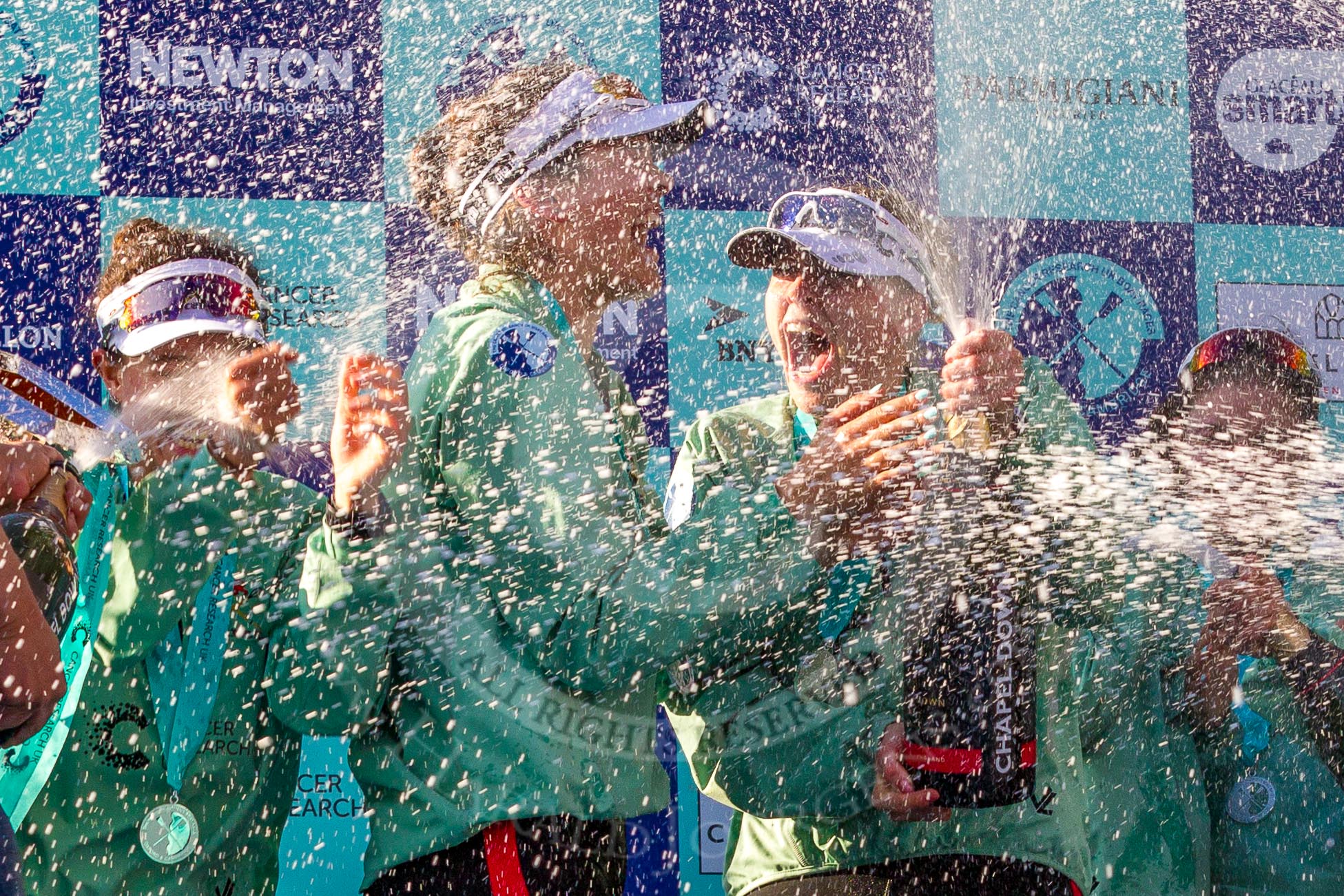 The Boat Race season 2017 -  The Cancer Research Women's Boat Race: CUWBC covered in spray (Cahmpagne, not Thames water) at the price giving.
River Thames between Putney Bridge and Mortlake,
London SW15,

United Kingdom,
on 02 April 2017 at 17:13, image #267