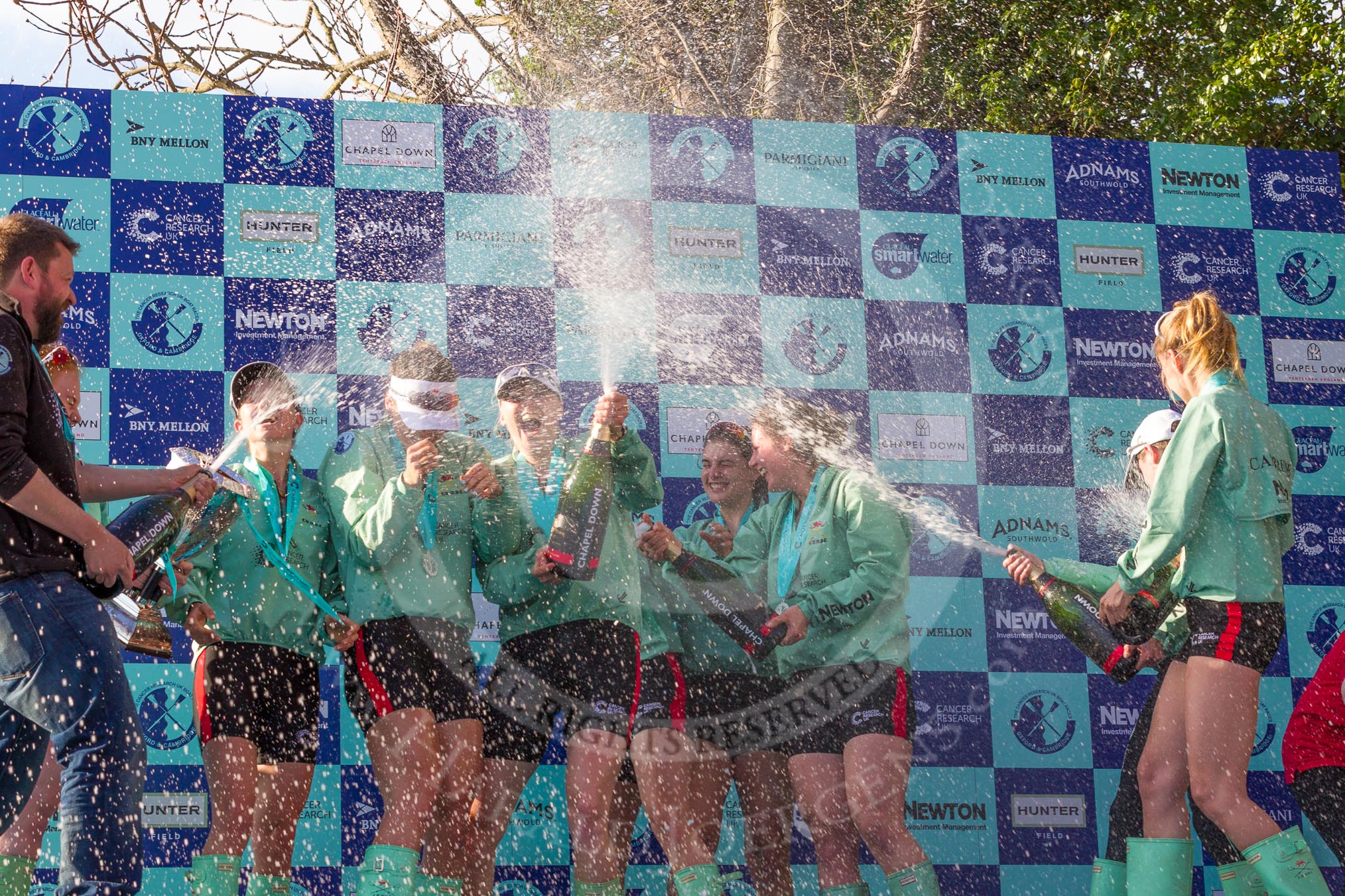 The Boat Race season 2017 -  The Cancer Research Women's Boat Race: CUWBC covered in spray (Cahmpagne, not Thames water) at the price giving.
River Thames between Putney Bridge and Mortlake,
London SW15,

United Kingdom,
on 02 April 2017 at 17:13, image #270