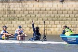 The Boat Race season 2017 -  The Cancer Research Women's Boat Race: The Oxford eight at the stake boat 7 Jenna Hebert, stroke Emily Cameron, cox Eleanor Shearer), Eleanor Shearer indicating that they are not ready yet.
River Thames between Putney Bridge and Mortlake,
London SW15,

United Kingdom,
on 02 April 2017 at 16:34, image #118