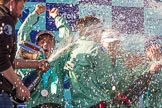 The Boat Race season 2017 -  The Cancer Research Women's Boat Race: CUWBC head coach Rob Barker spraying Champagne at the crew, on his right cox Matthew Holland.
River Thames between Putney Bridge and Mortlake,
London SW15,

United Kingdom,
on 02 April 2017 at 17:13, image #264