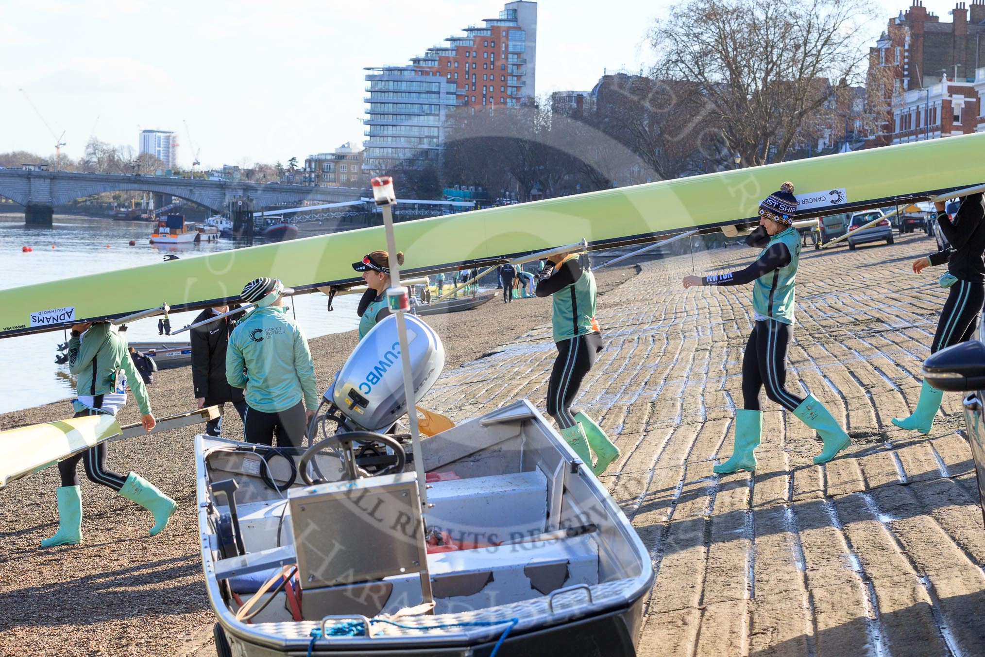 The Women's Boat Race season 2018 - fixture CUWBC vs. ULBC: The CUWBC crew carrying their boat from the boat house to the river.
River Thames between Putney Bridge and Mortlake,
London SW15,

United Kingdom,
on 17 February 2018 at 12:28, image #2