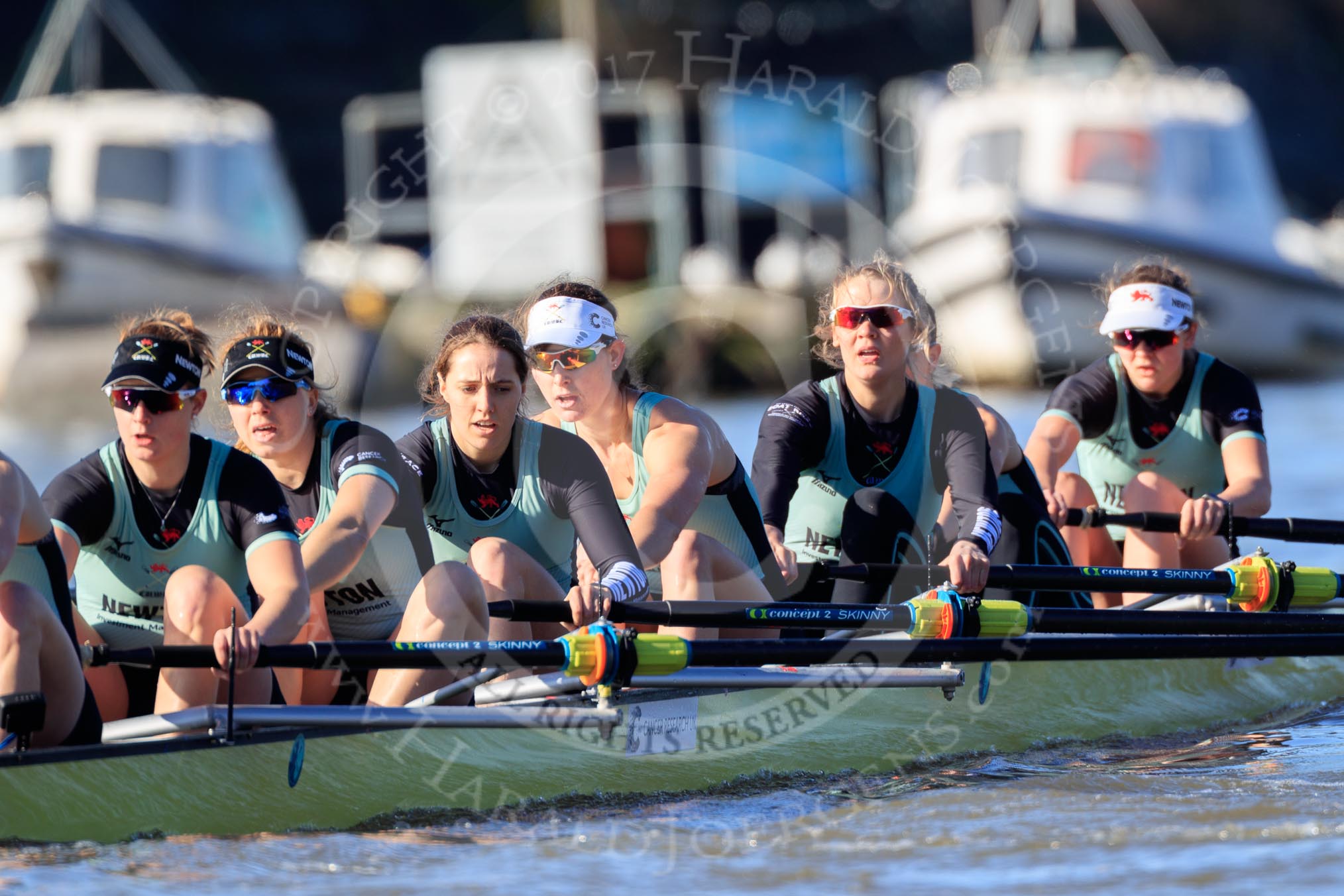 The Women's Boat Race season 2018 - fixture CUWBC vs. ULBC: CUWBC extending their lead near the Putney boat houses - here stroke Tricia Smith, 7 Imogen Grant, 6 Anne Beenken, 5 Thea Zabell, 4 Paula Wesselmann, 3 Alice White, 2 Myriam Goudet-Boukhatmi, bow Olivia Coffey.
River Thames between Putney Bridge and Mortlake,
London SW15,

United Kingdom,
on 17 February 2018 at 13:10, image #59