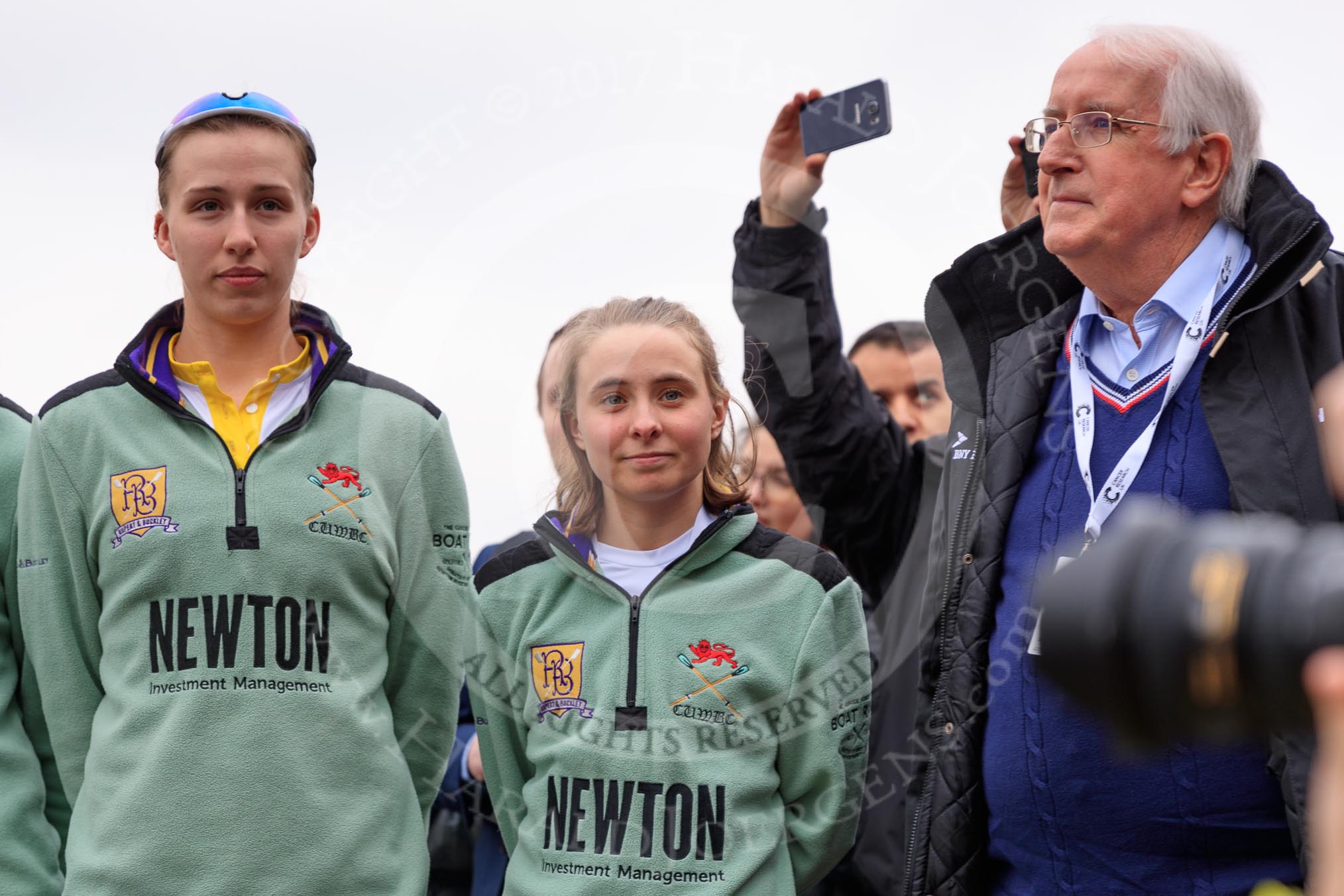 The Cancer Research UK Women's Boat Race 2018: At the Women's Boat Race toss - Cambridge stroke Millie Perrin, and cox Sophie Wrixon, with sports broadcaster David Mercer.
River Thames between Putney Bridge and Mortlake,
London SW15,

United Kingdom,
on 24 March 2018 at 14:55, image #72