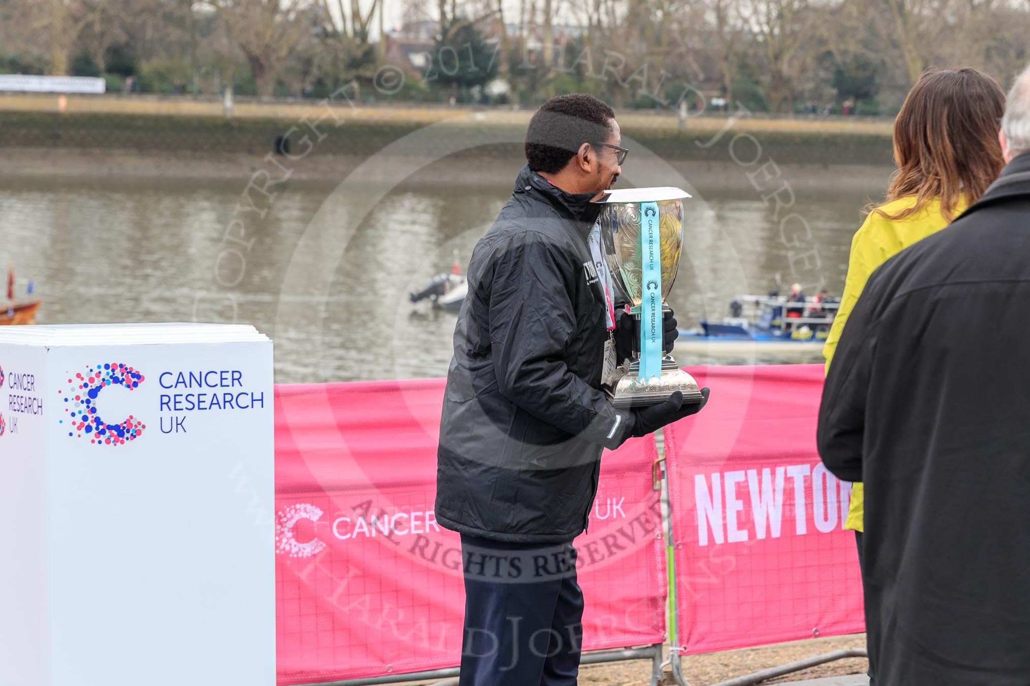 The Cancer Research UK Women's Boat Race 2018: After the toss - the Women's Boat Race trophy is removed for the trip to Mortlake, and the finish of the race.
River Thames between Putney Bridge and Mortlake,
London SW15,

United Kingdom,
on 24 March 2018 at 14:56, image #73