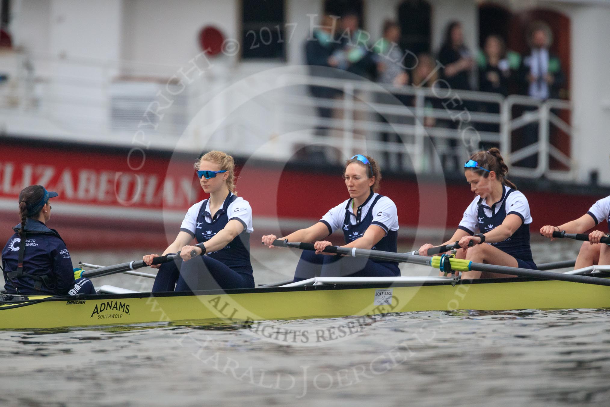 The Cancer Research UK Women's Boat Race 2018: The Oxford Blue Boat just before the start of the race - cox Jessica Buck, stroke Beth Bridgman, 7 Abigail Killen, 6	Sara Kushma.
River Thames between Putney Bridge and Mortlake,
London SW15,

United Kingdom,
on 24 March 2018 at 16:28, image #159