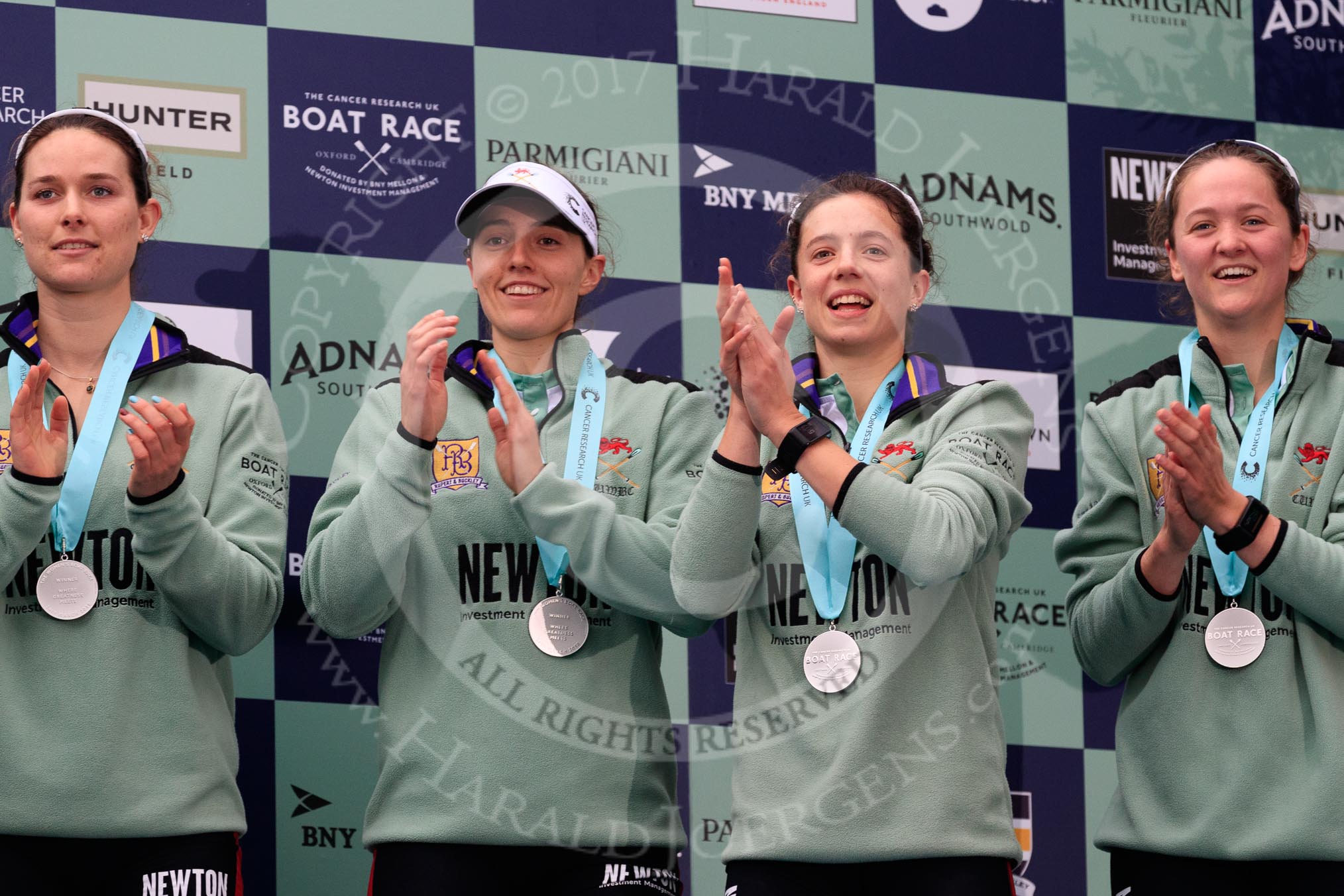 The Cancer Research UK Women's Boat Race 2018: Cambridge  4 seat Thea Zabell, 3 seat Kelsey Barolak, 2 seat Imogen Grant, and  bow seat Tricia Smith, with her Women's Boat Race medals. on the podium.
River Thames between Putney Bridge and Mortlake,
London SW15,

United Kingdom,
on 24 March 2018 at 17:07, image #265