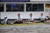 The Cancer Research UK Women's Boat Race 2018: The Cambridge Blue Boat just before the start of the race, with cox Sophie Shapter  indicating with her raised hand that they are not ready yet. Here stroke Olivia Coffey, 7 Myriam Goudet-Boukhatmi, 6 Alice White, 5 Paula Wesselmann.
River Thames between Putney Bridge and Mortlake,
London SW15,

United Kingdom,
on 24 March 2018 at 16:28, image #158