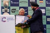 The Cancer Research UK Women's Boat Race 2018: Sir Harpal Kumar, CEO of Cancer Research UK. getting the medals for the Women's Boat Race winners at the trophy presentation.
River Thames between Putney Bridge and Mortlake,
London SW15,

United Kingdom,
on 24 March 2018 at 17:06, image #249