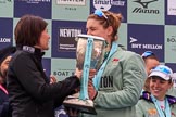 The Cancer Research UK Women's Boat Race 2018: Newton Investment CEO Hanneke Smits handing the Women's Boat Race trophy to Cambridge 7 seat Myriam Goudet-Boukhatmi.
River Thames between Putney Bridge and Mortlake,
London SW15,

United Kingdom,
on 24 March 2018 at 17:09, image #274
