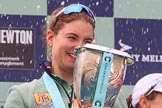 The Cancer Research UK Women's Boat Race 2018: Cambridge 7 seat Myriam Goudet-Boukhatmi with the Women's Boat Race trophy, showered with champagne.
River Thames between Putney Bridge and Mortlake,
London SW15,

United Kingdom,
on 24 March 2018 at 17:09, image #275