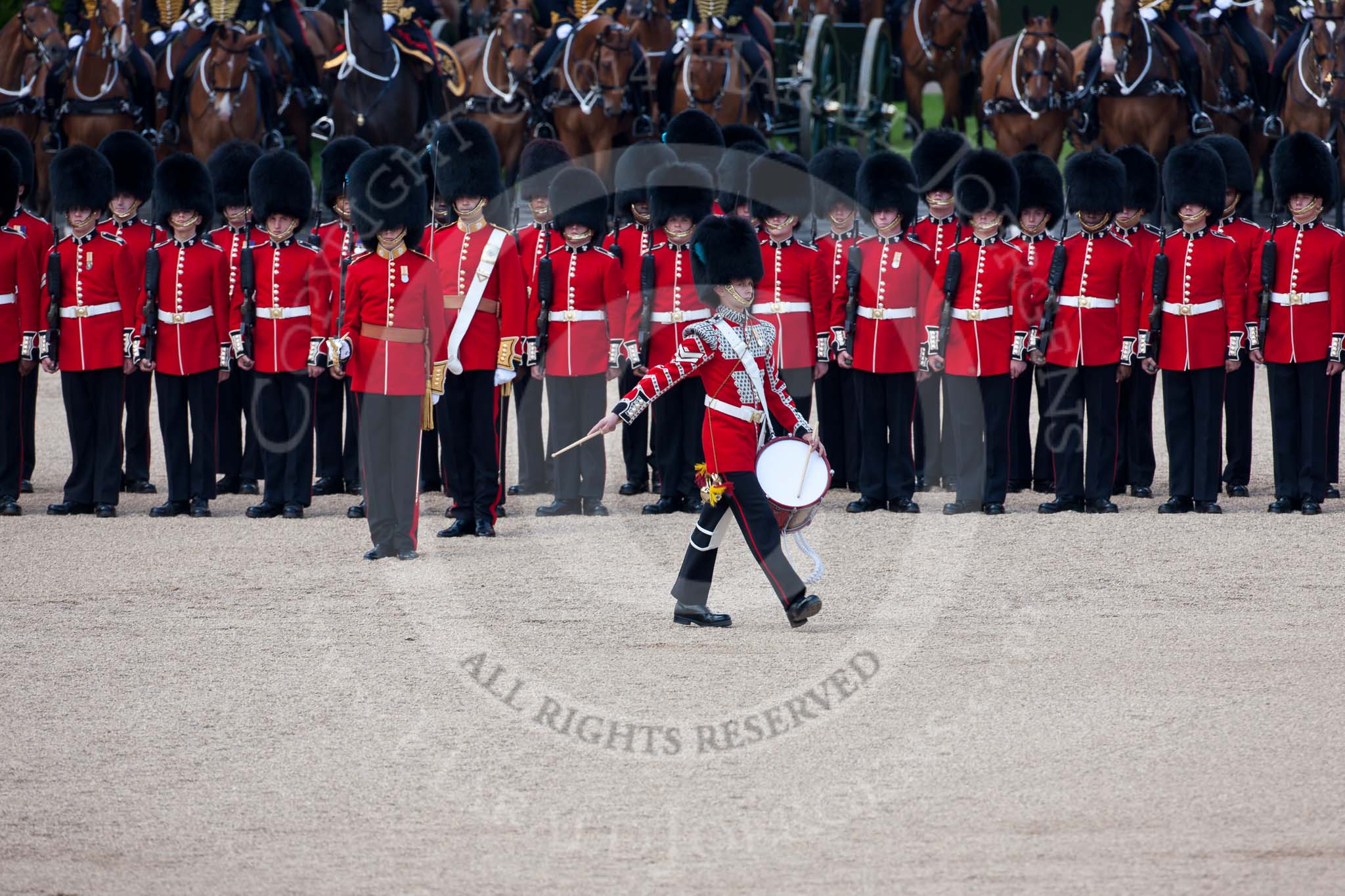 Trooping the Colour 2009: The Lone Drummer. Lance Corporal John Smiley, is breaking the line to perform the Drummers Call. Behind, with the white colour belt, the Ensign, 2nd Lieutenant Andrew Campbell..
Horse Guards Parade, Westminster,
London SW1,

United Kingdom,
on 13 June 2009 at 11:15, image #174