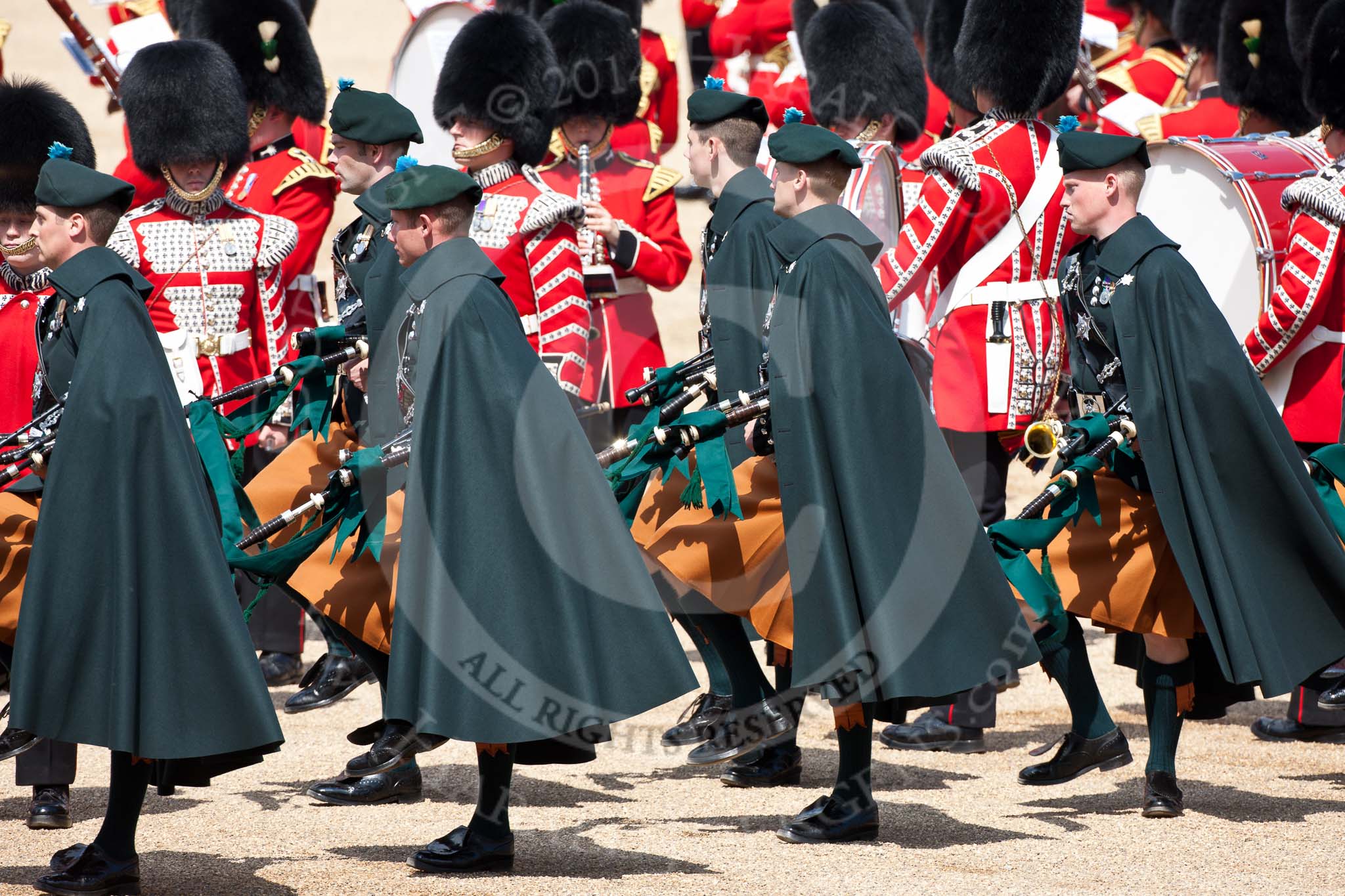 Trooping the Colour 2009: Irish Guards Pipers in their bottle green tunics and saffron coloured kilts with a bottle green cape, in front of Drummers..
Horse Guards Parade, Westminster,
London SW1,

United Kingdom,
on 13 June 2009 at 11:17, image #180