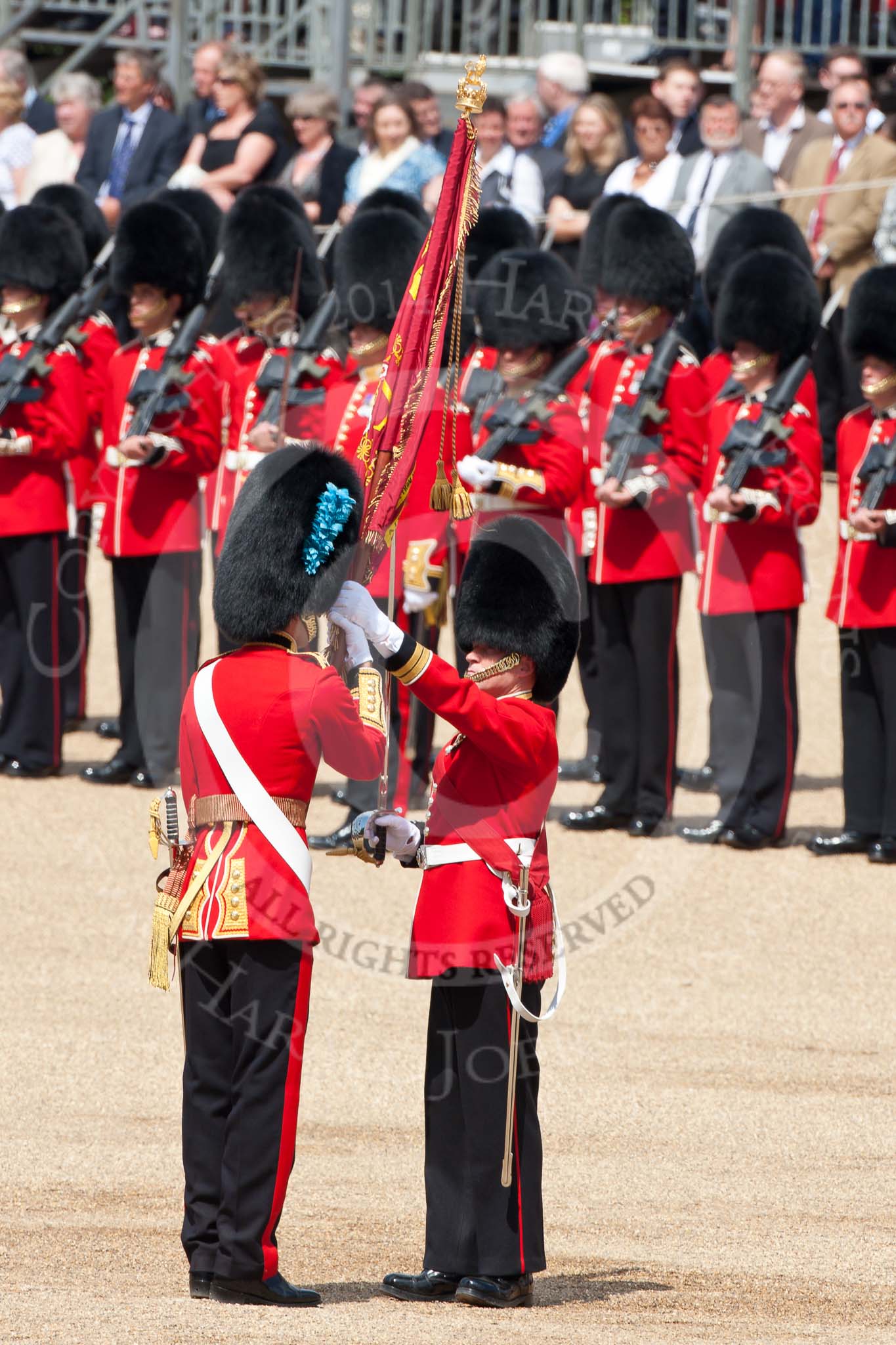 Trooping the Colour 2009: The Regimental Sergeant Major, WO1 Ross Martin, is handing over the Colour to the Ensign, 2nd Lieutenant Andrew Campbell, by placing it into his colour belt..
Horse Guards Parade, Westminster,
London SW1,

United Kingdom,
on 13 June 2009 at 11:21, image #187