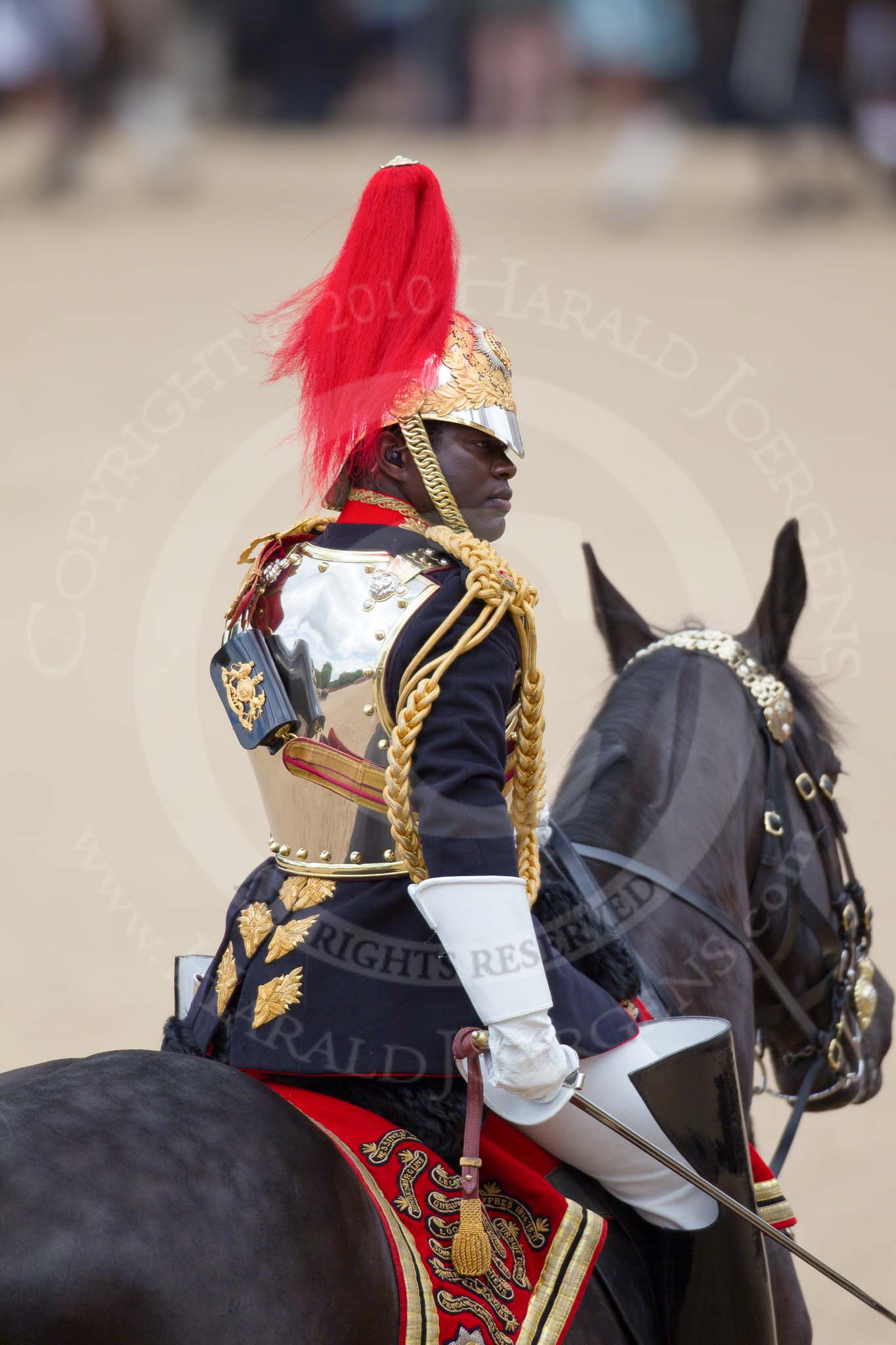 Trooping the Colour 2010: Field Officer of the Escort, Major N K Twumasi Ankrah, The Blues and Royals, during the Ride Past.

Most impressive are the reflections on his shield, especially when seen at full size!.
Horse Guards Parade, Westminster,
London SW1,
Greater London,
United Kingdom,
on 12 June 2010 at 11:56, image #176