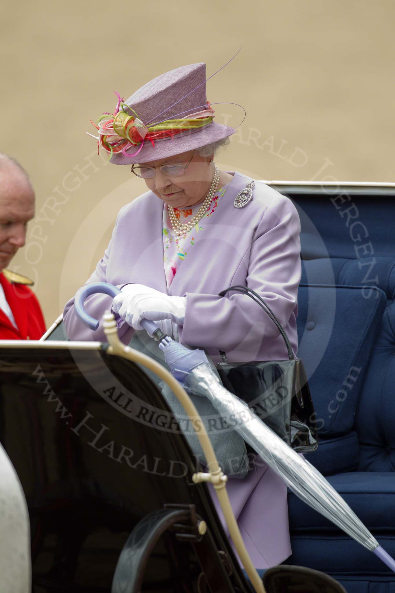 Trooping the Colour 2010: Her Majesty the Queen egtting into the Ivory Mounted Phaeton, at 'March Off', the last phase of the parade, about to leave..
Horse Guards Parade, Westminster,
London SW1,
Greater London,
United Kingdom,
on 12 June 2010 at 12:09, image #191