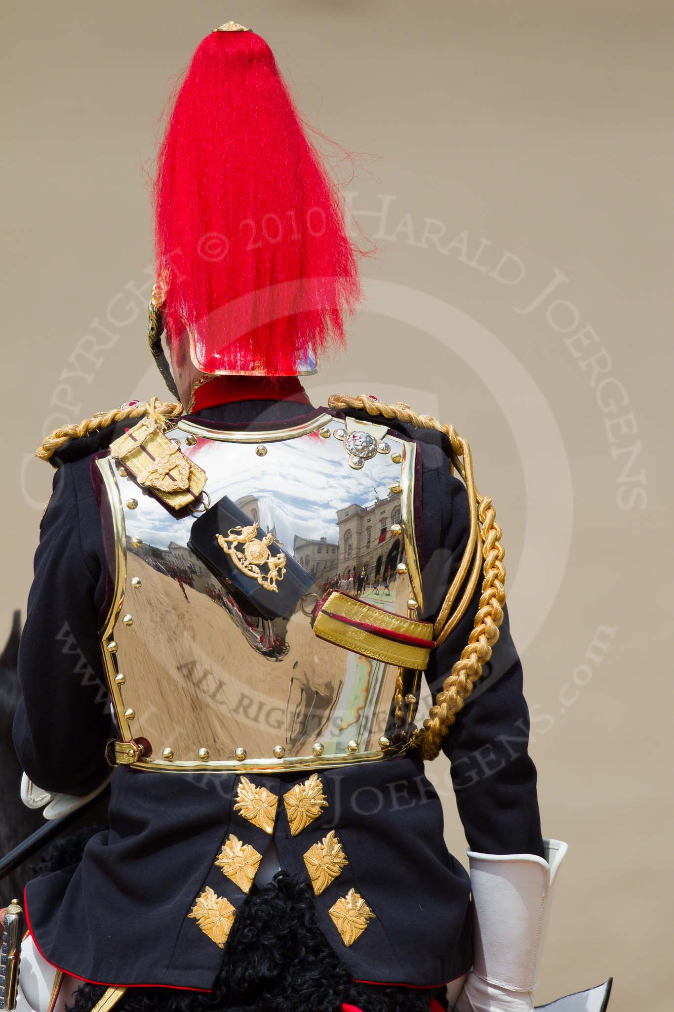 Trooping the Colour 2010: Colonel T W Browne, The Blues and Royals, Silver Stick in Waiting, at the end of parade, marching off.

Horse Guards Parade is beautifully reflected in the rear shield of his uniform (please correct me if 'rear shield' is the wrong phrase!)..
Horse Guards Parade, Westminster,
London SW1,
Greater London,
United Kingdom,
on 12 June 2010 at 12:12, image #193