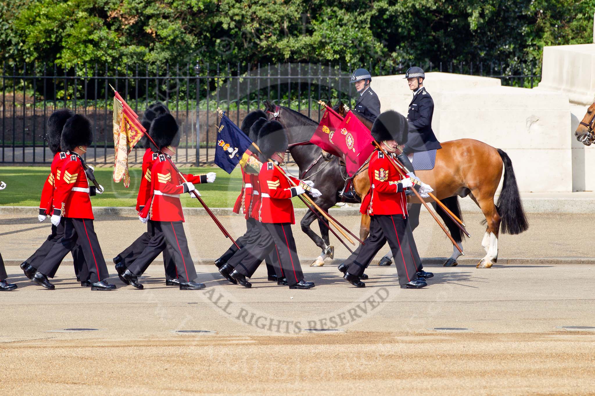 The Colonel's Review 2011: 'Keepers of the Ground' meeting the Metropolitan Police at the Guards Memorial. The guardsman are bearing marker flags which will be used to mark the position of No. 1 to No. 6 guard on the parade ground..
Horse Guards Parade, Westminster,
London SW1,

United Kingdom,
on 04 June 2011 at 09:38, image #3