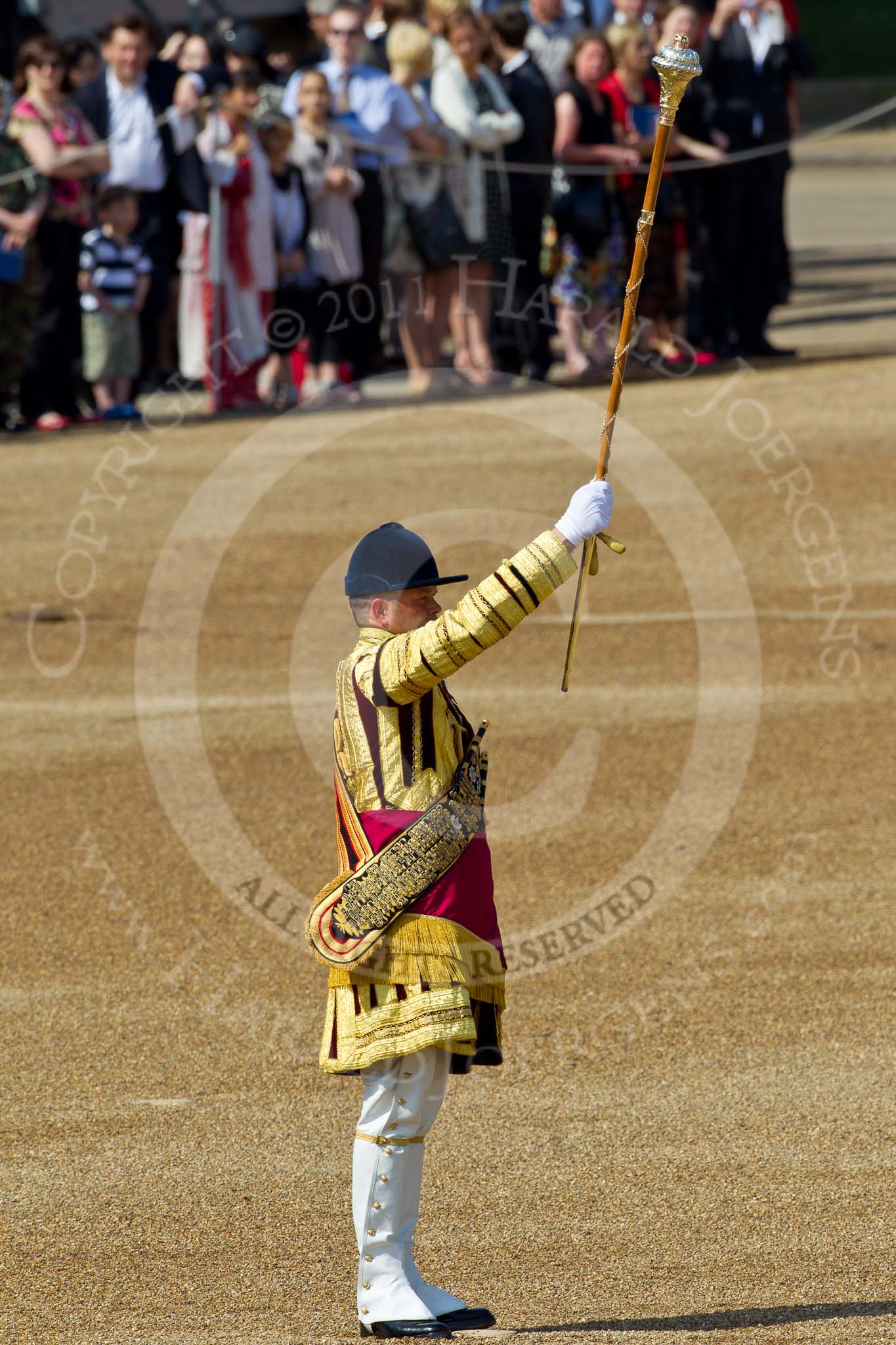 The Colonel's Review 2011: Senior Drum Major Ben Roberts, the first Drum Major to arrive with his band on Horse Guards Parade. In the beckground spectators watching from the Downing Street side of the parade ground..
Horse Guards Parade, Westminster,
London SW1,

United Kingdom,
on 04 June 2011 at 10:14, image #11